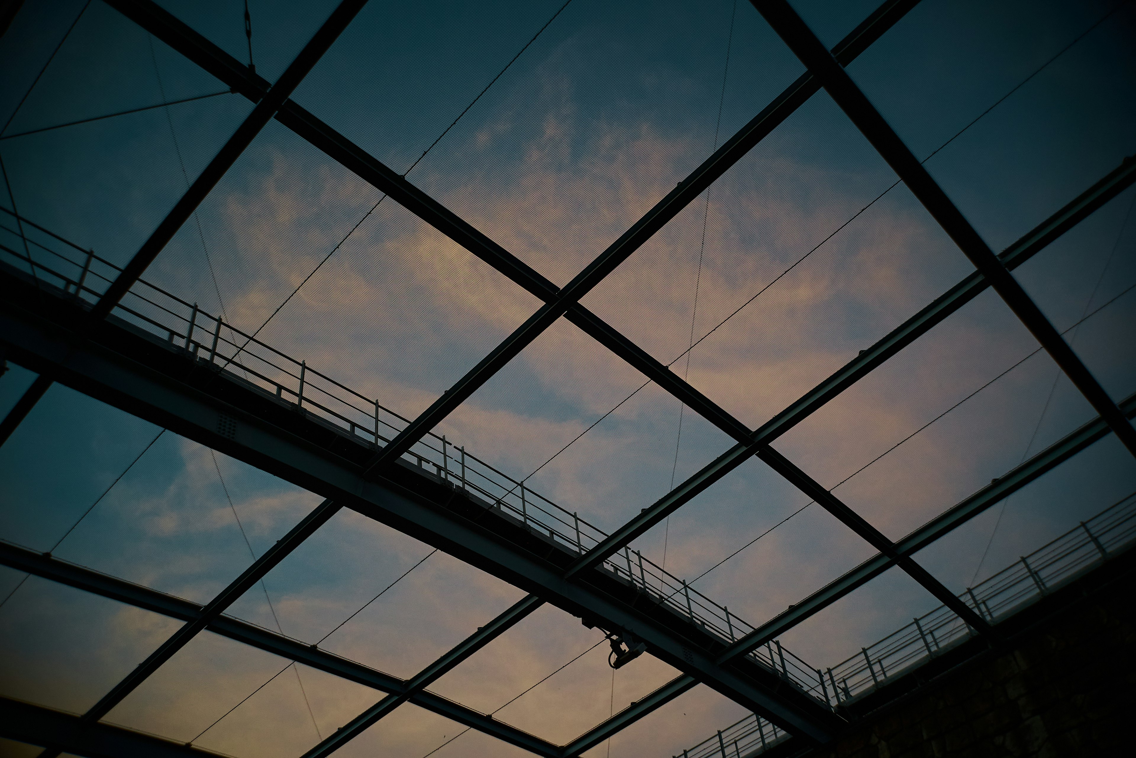 Glass roof with blue sky view