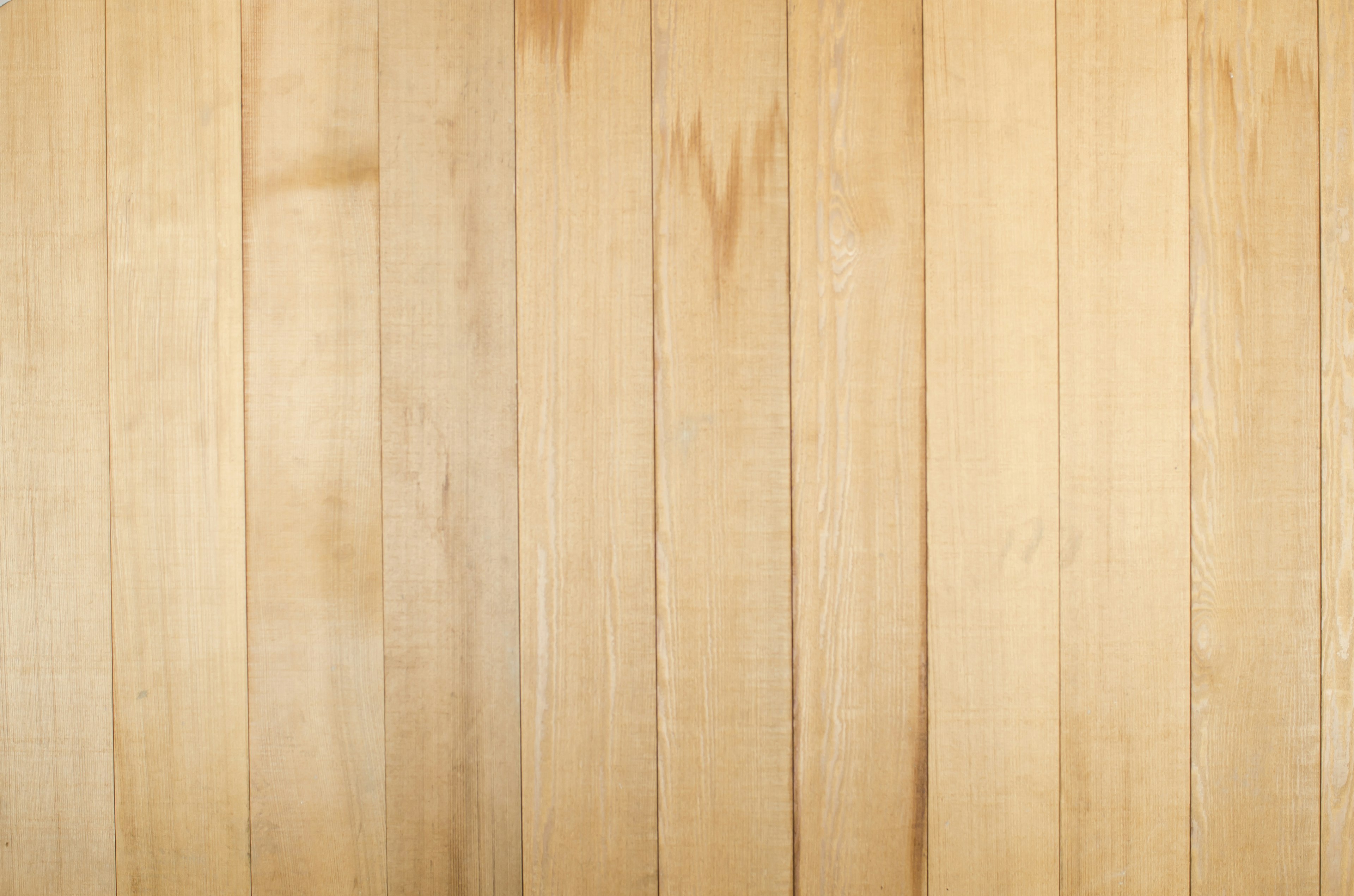 Light-colored wooden planks arranged vertically