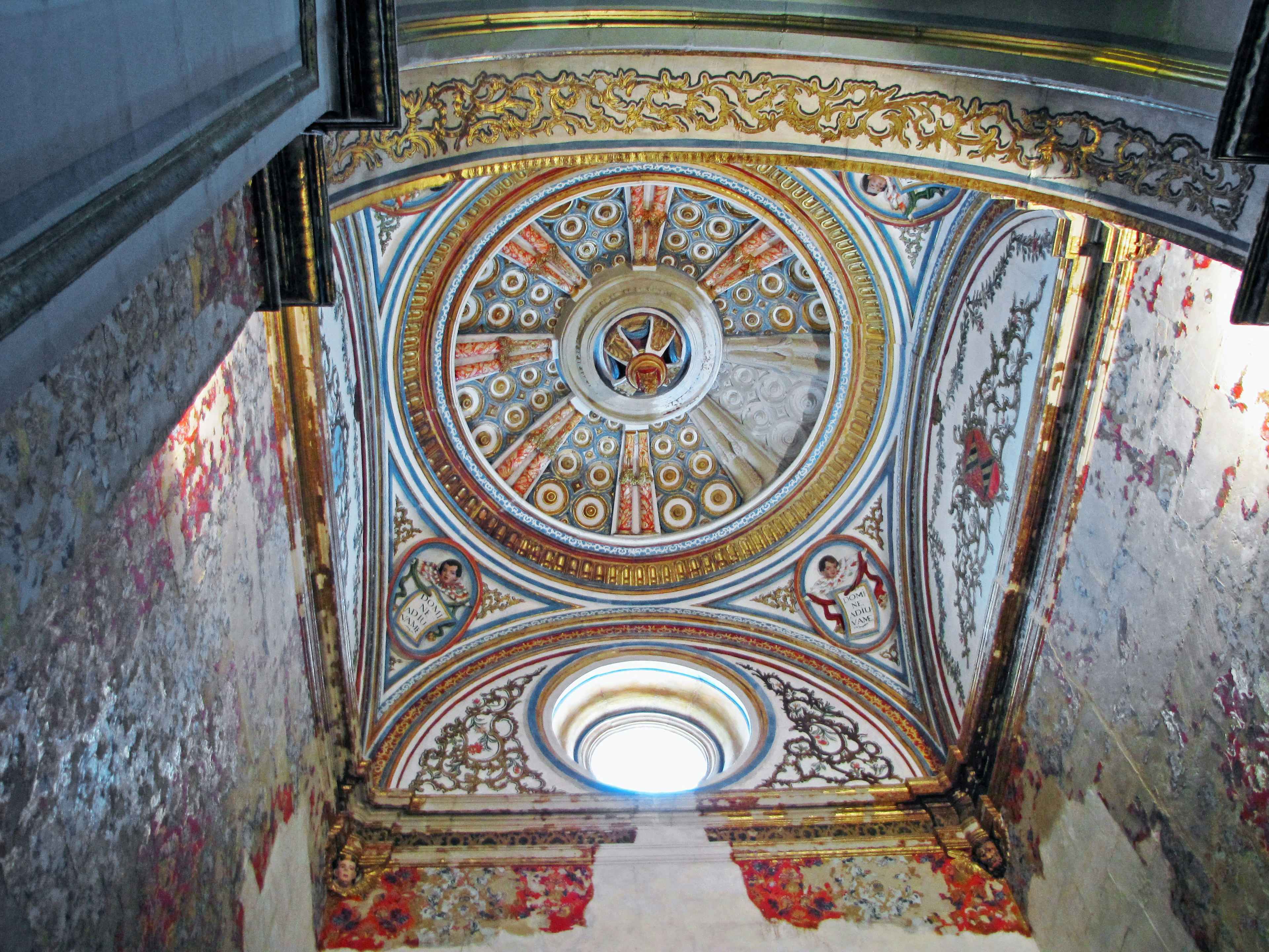 Image of a vibrant ceiling decoration with a circular design in an indoor space