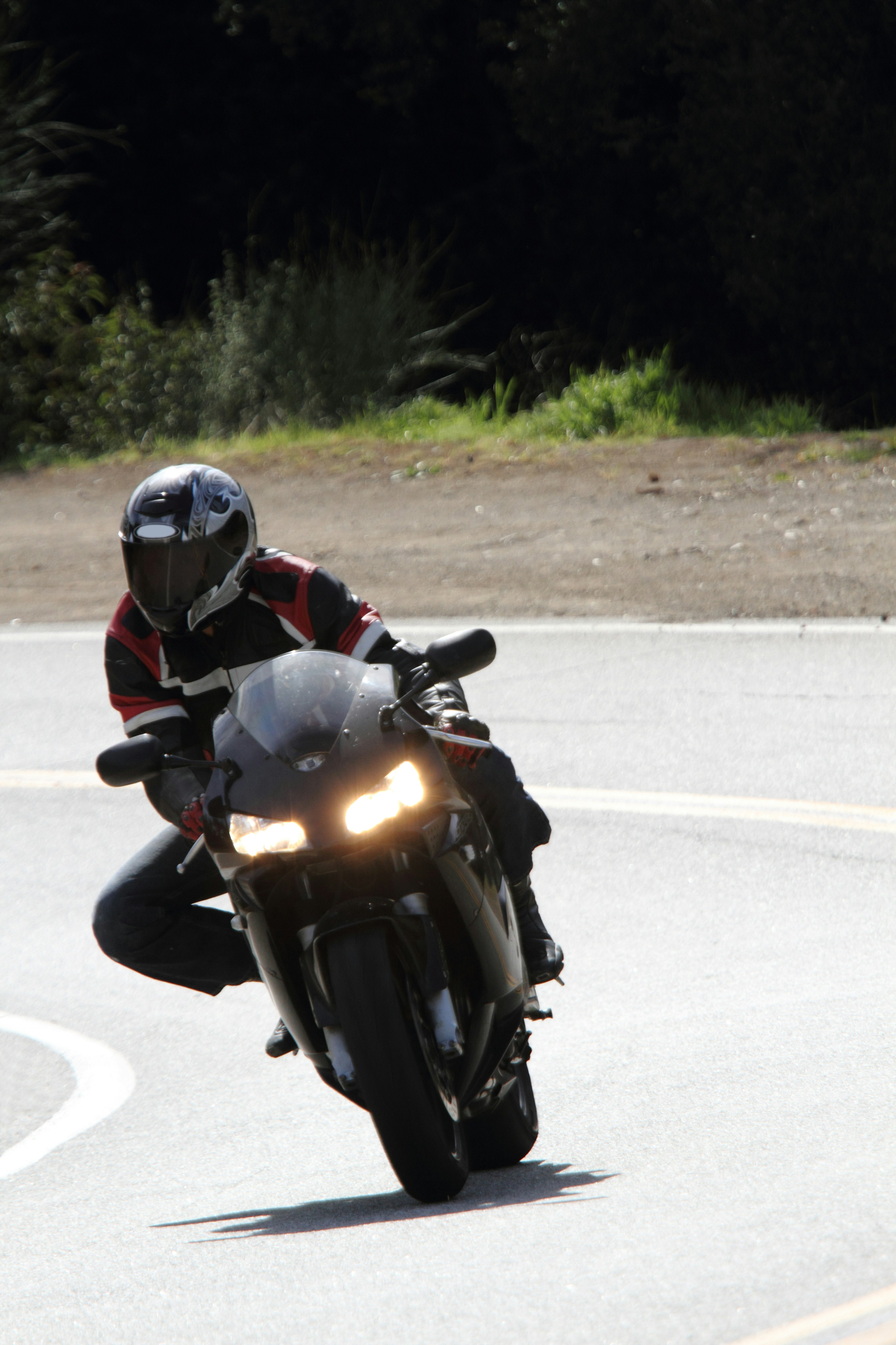 A rider leaning into a curve on a motorcycle