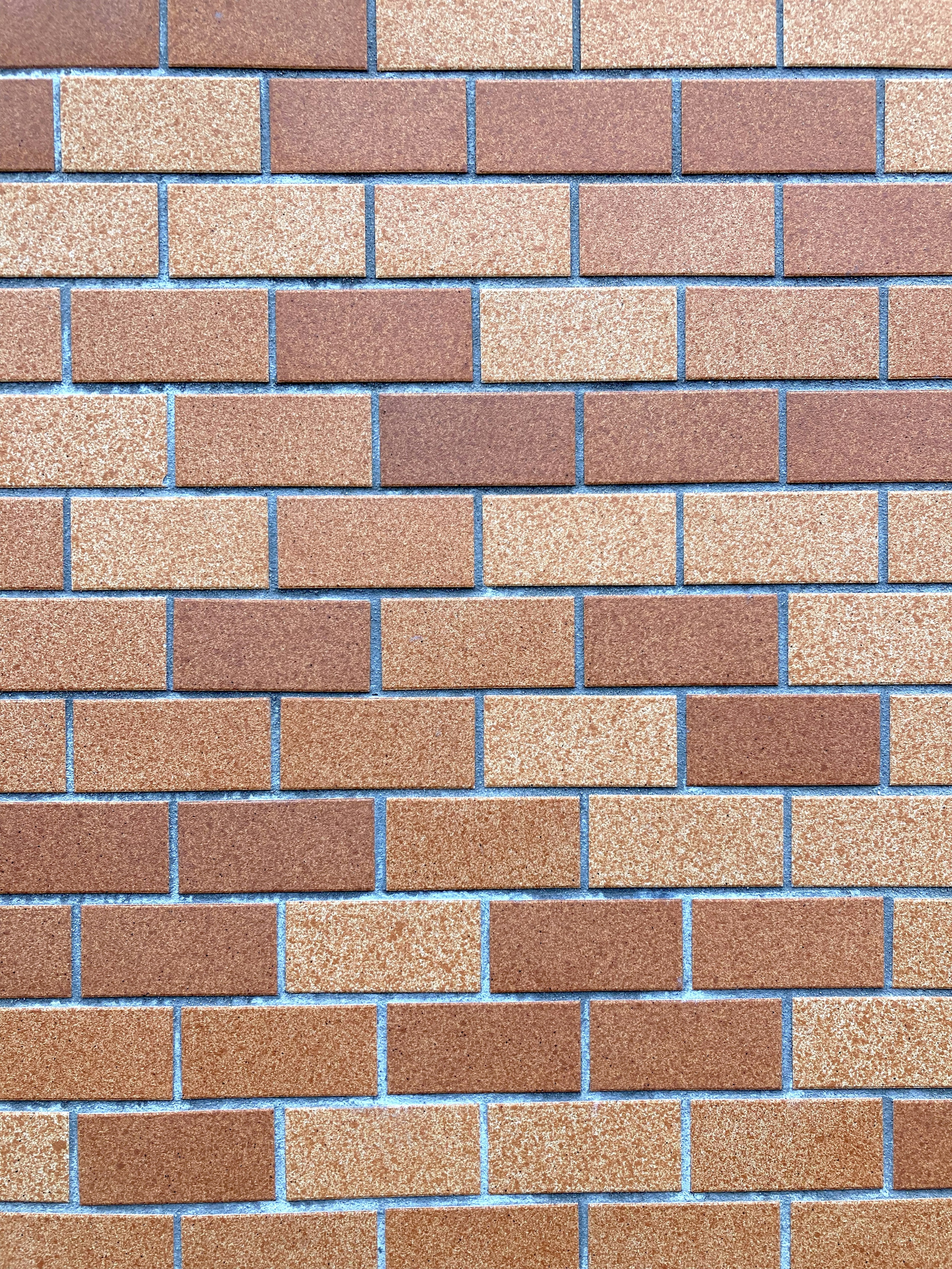 Textured wall made of brown bricks