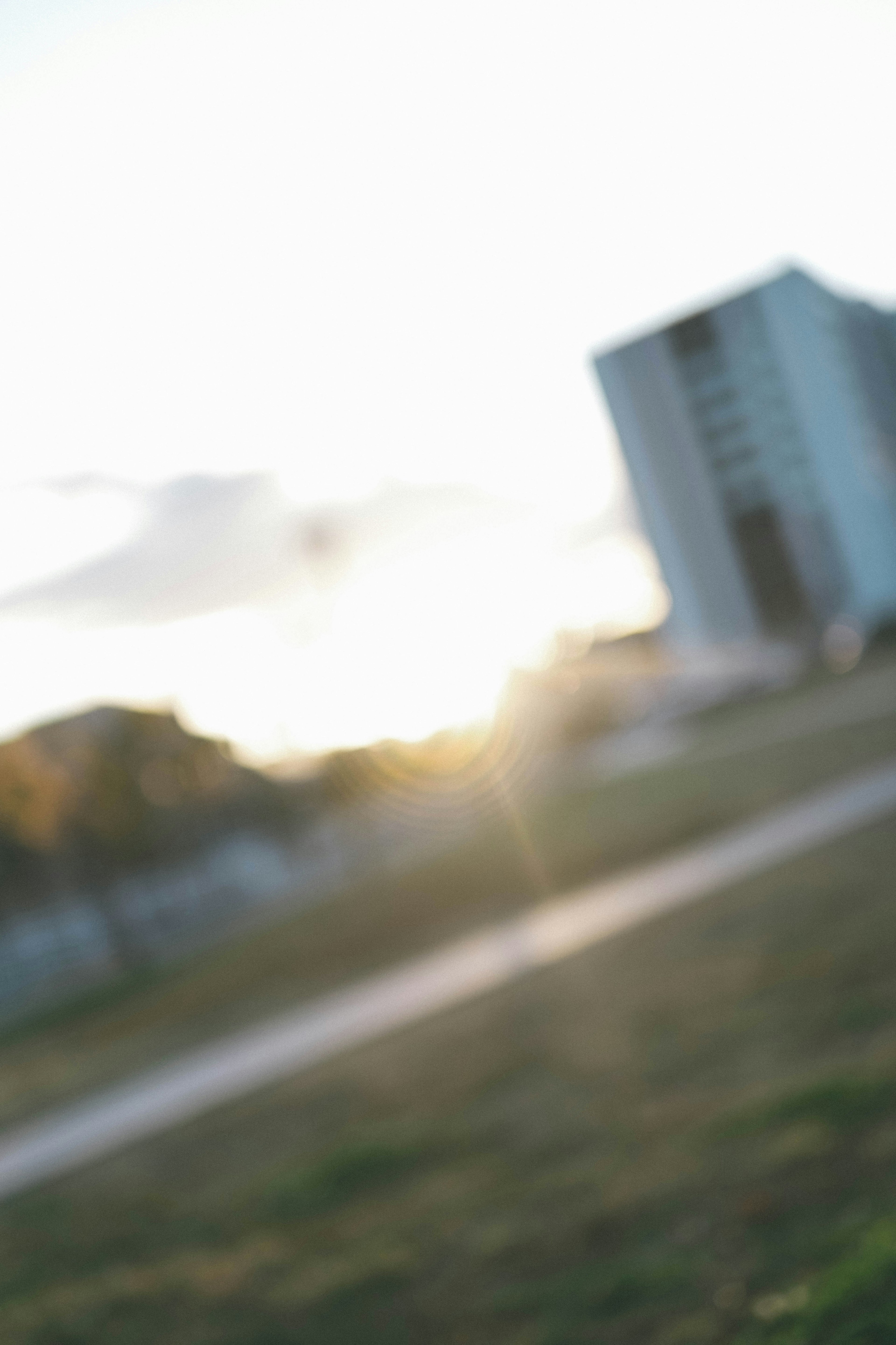 Blurred background with a sunset scene and a building