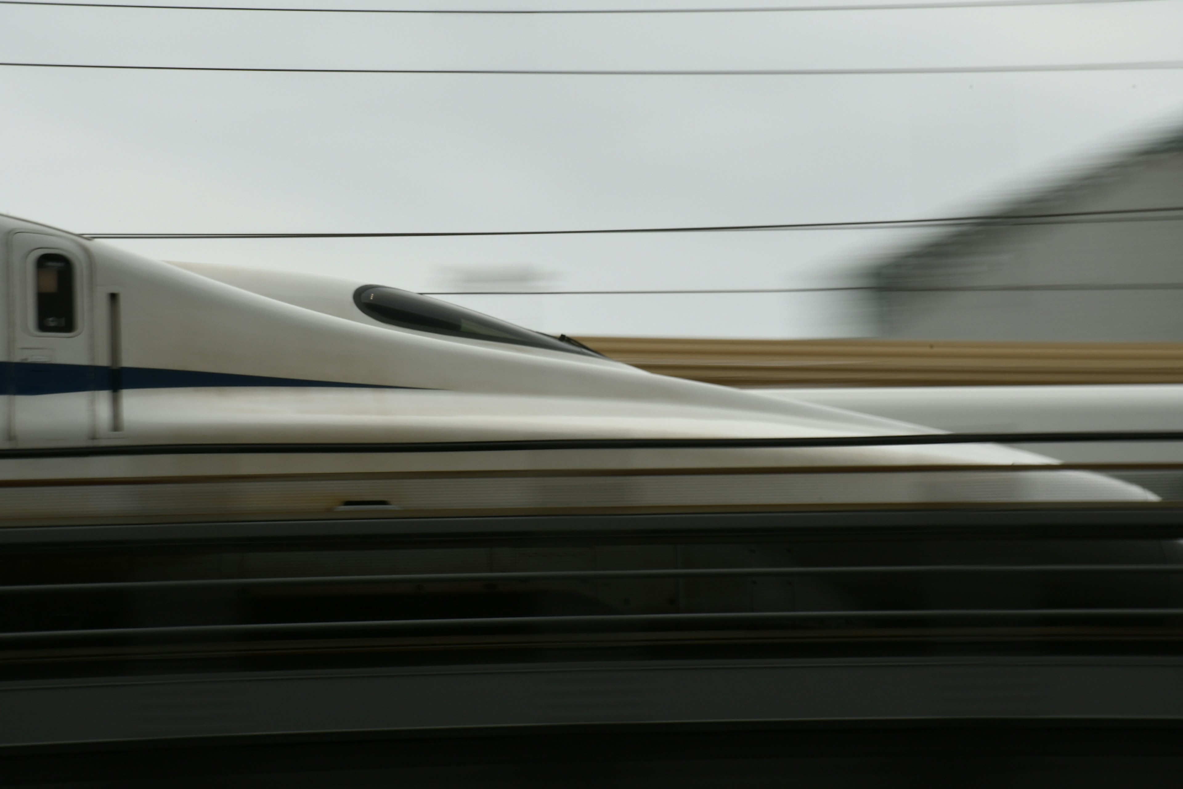 Shinkansen train in motion with a blurred background