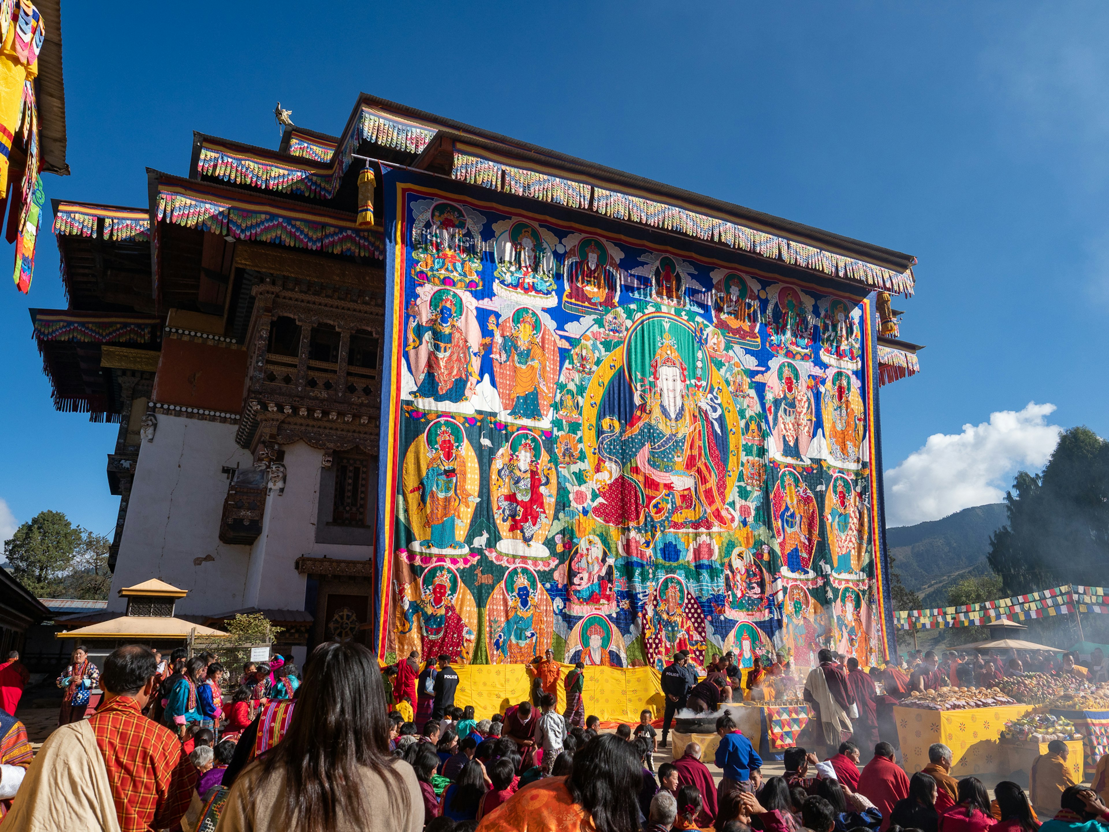 Large thangka and crowd at a Buddhist festival