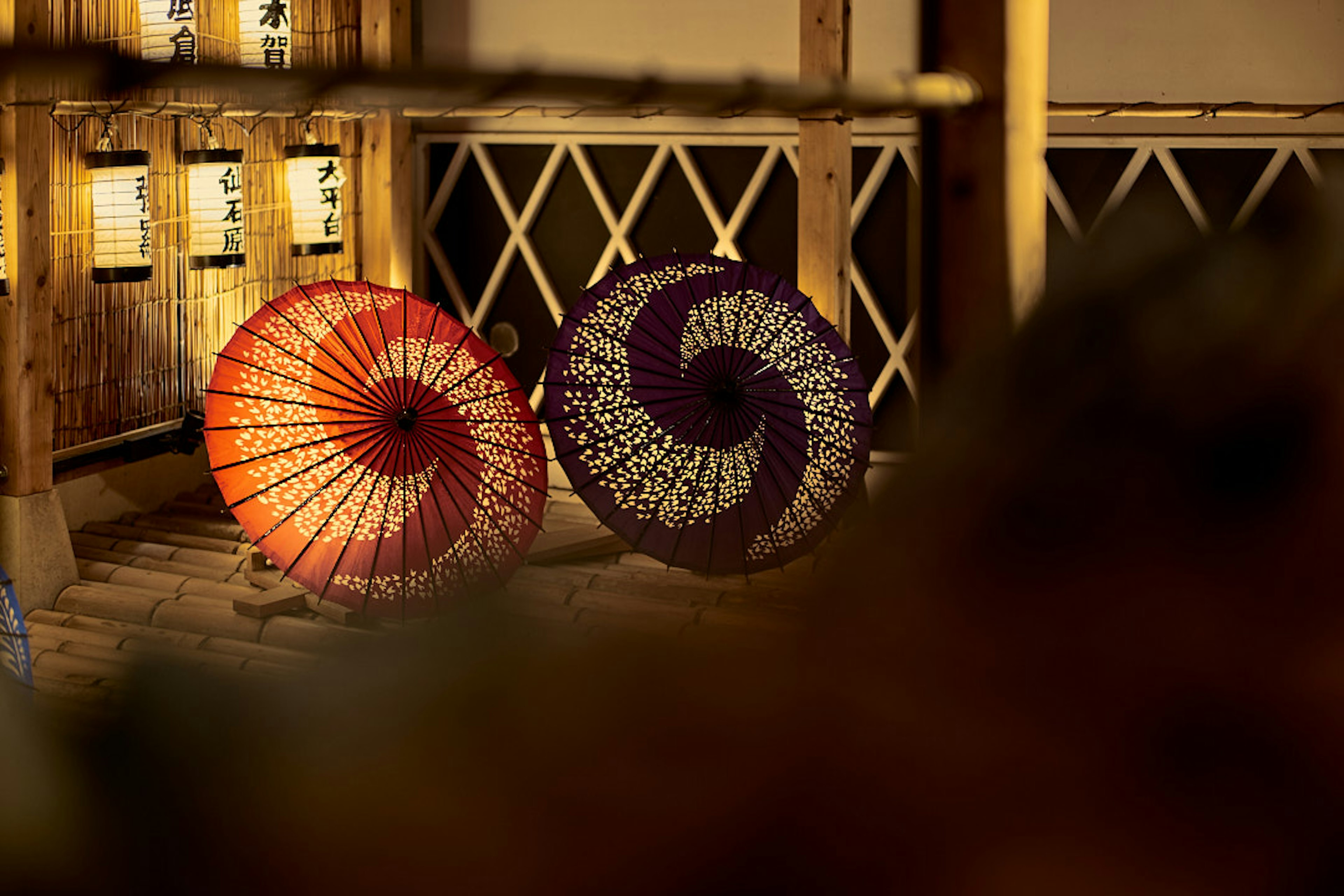 Two spiral patterned Japanese umbrellas in red and purple