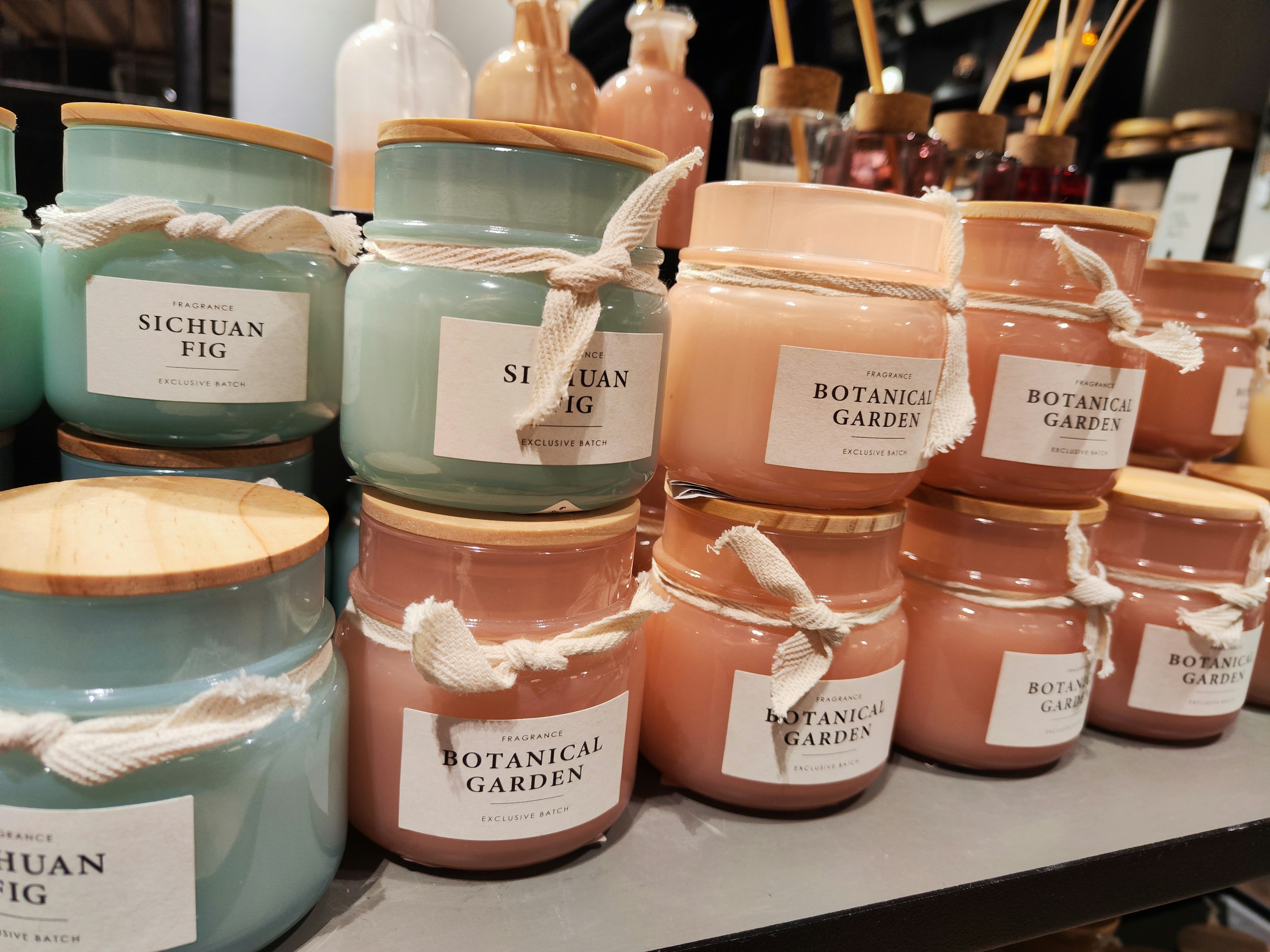 Colorful collection of candles displayed on a shelf