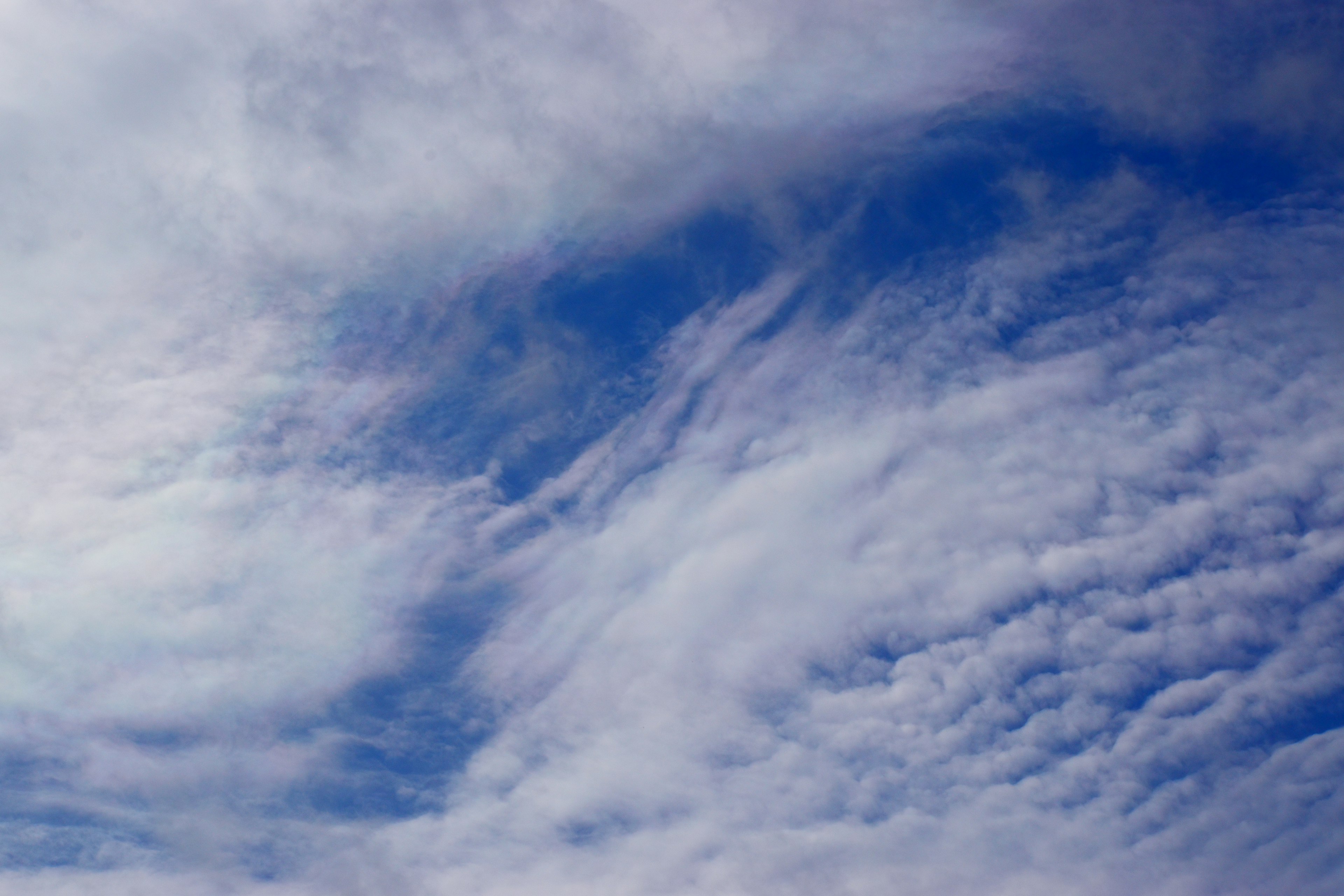 Pattern of white clouds in a blue sky