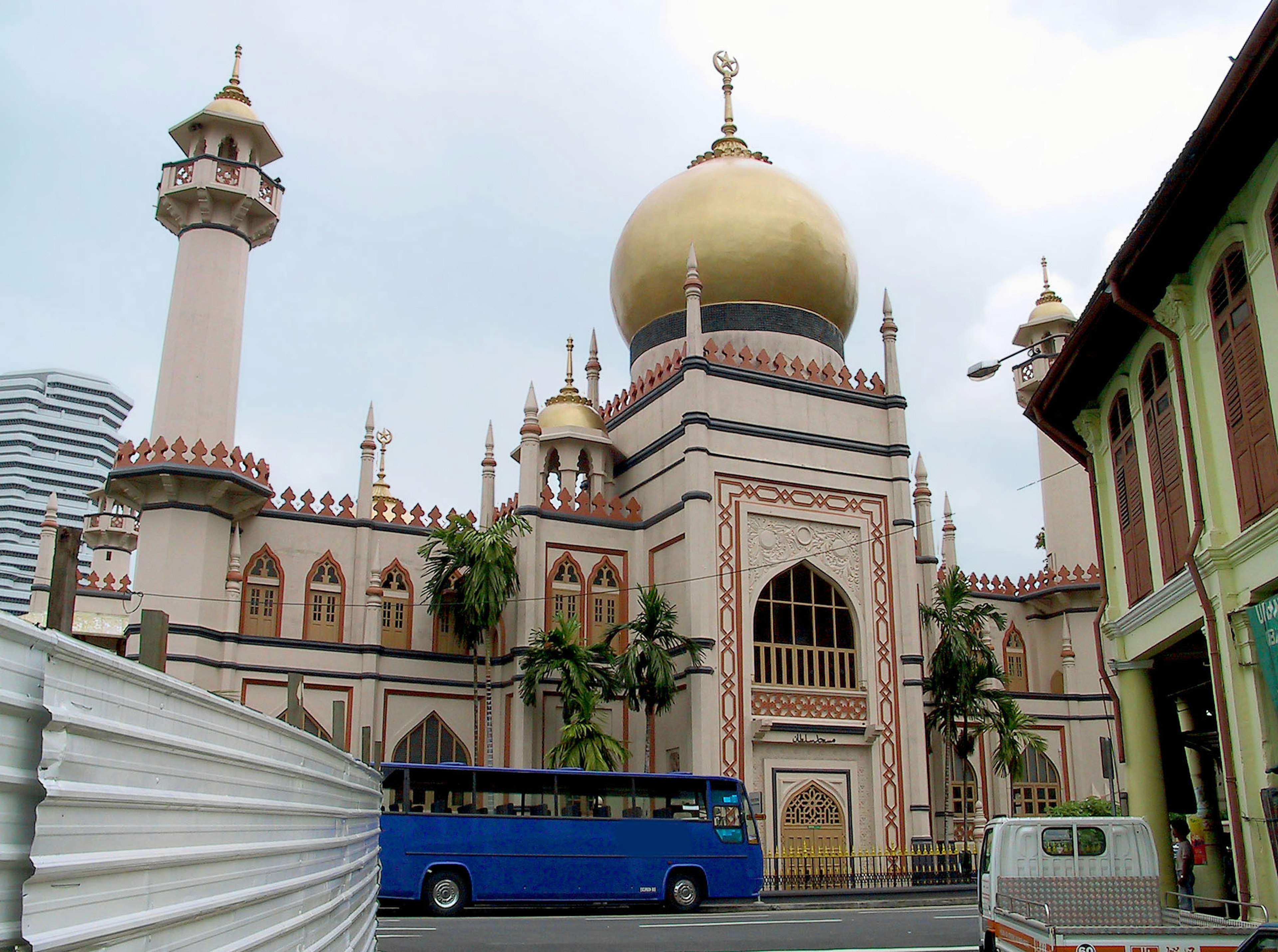 Beautiful mosque exterior with a golden dome and tall minarets