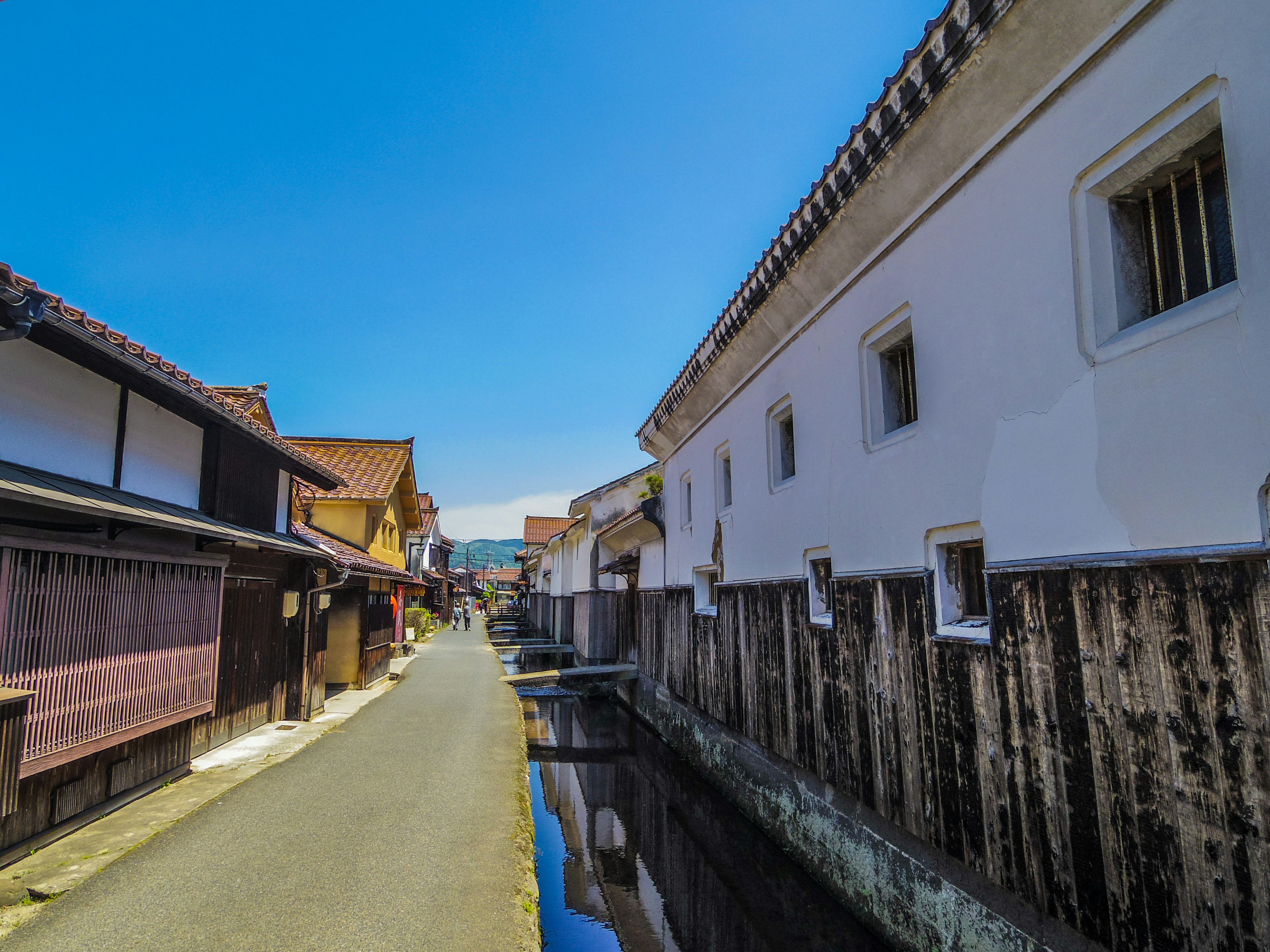 Narrow street with traditional Japanese architecture and canal