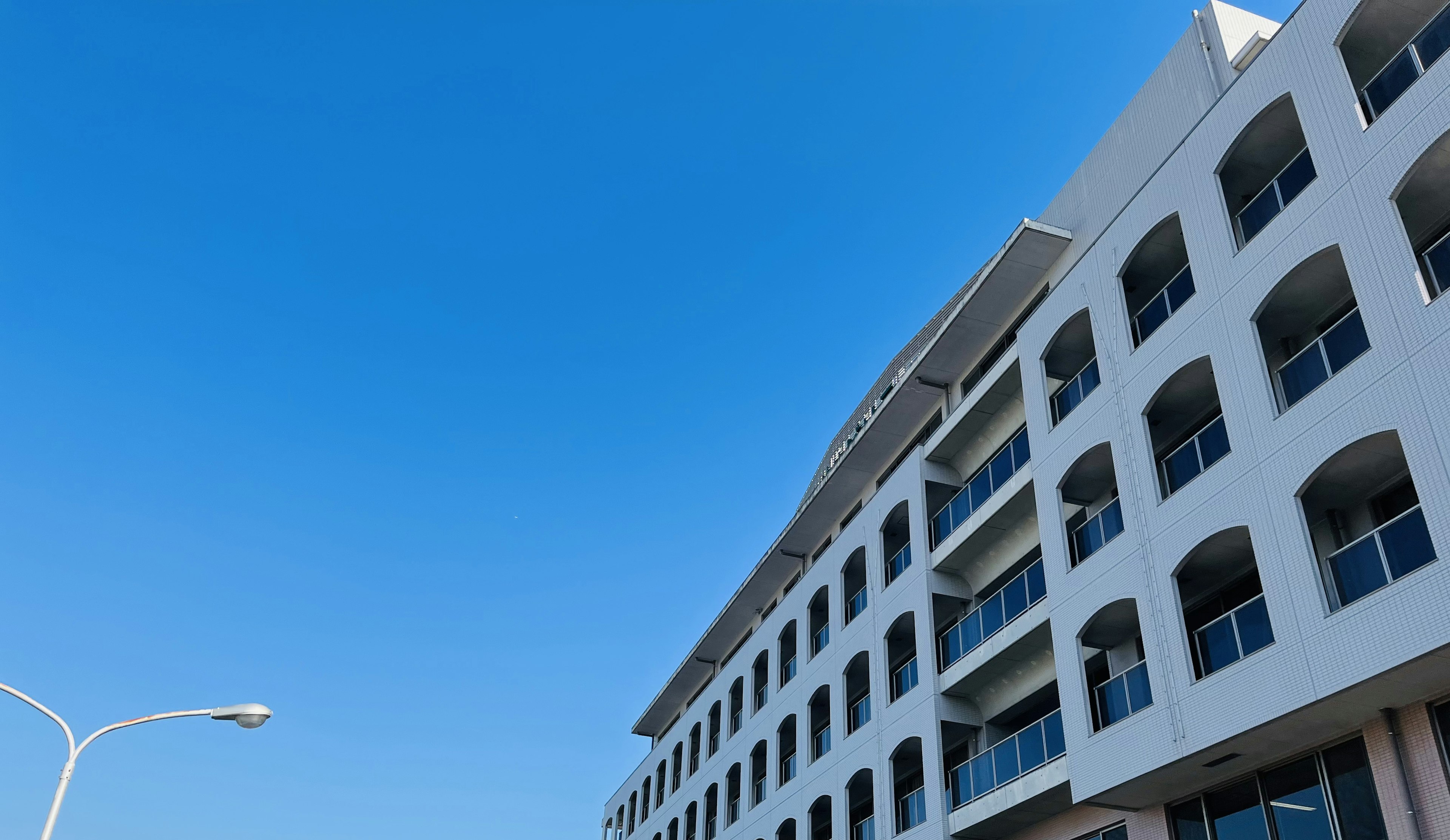 Modern building exterior under a clear blue sky