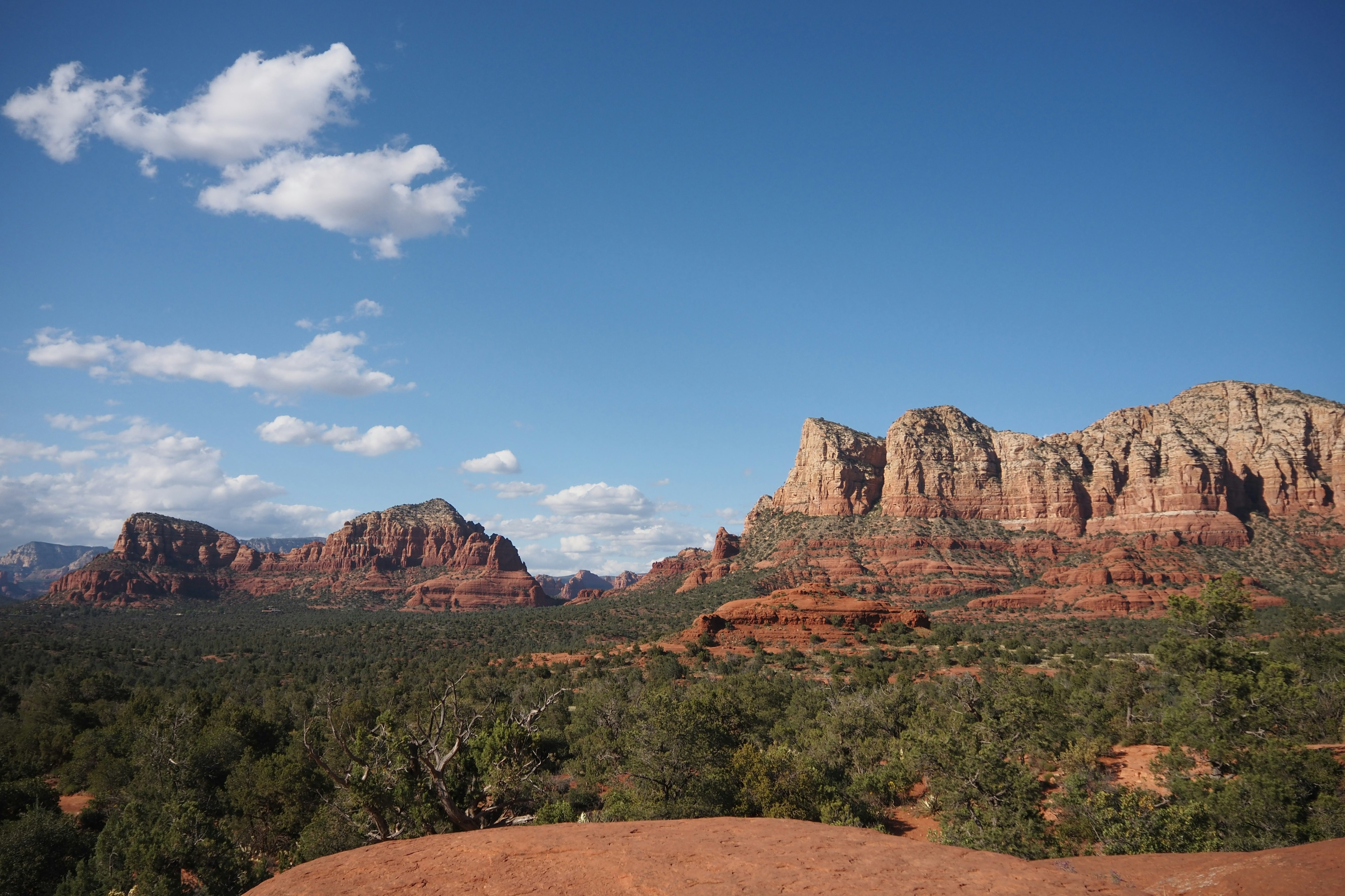 Scenic view of red rock formations in Sedona under a blue sky