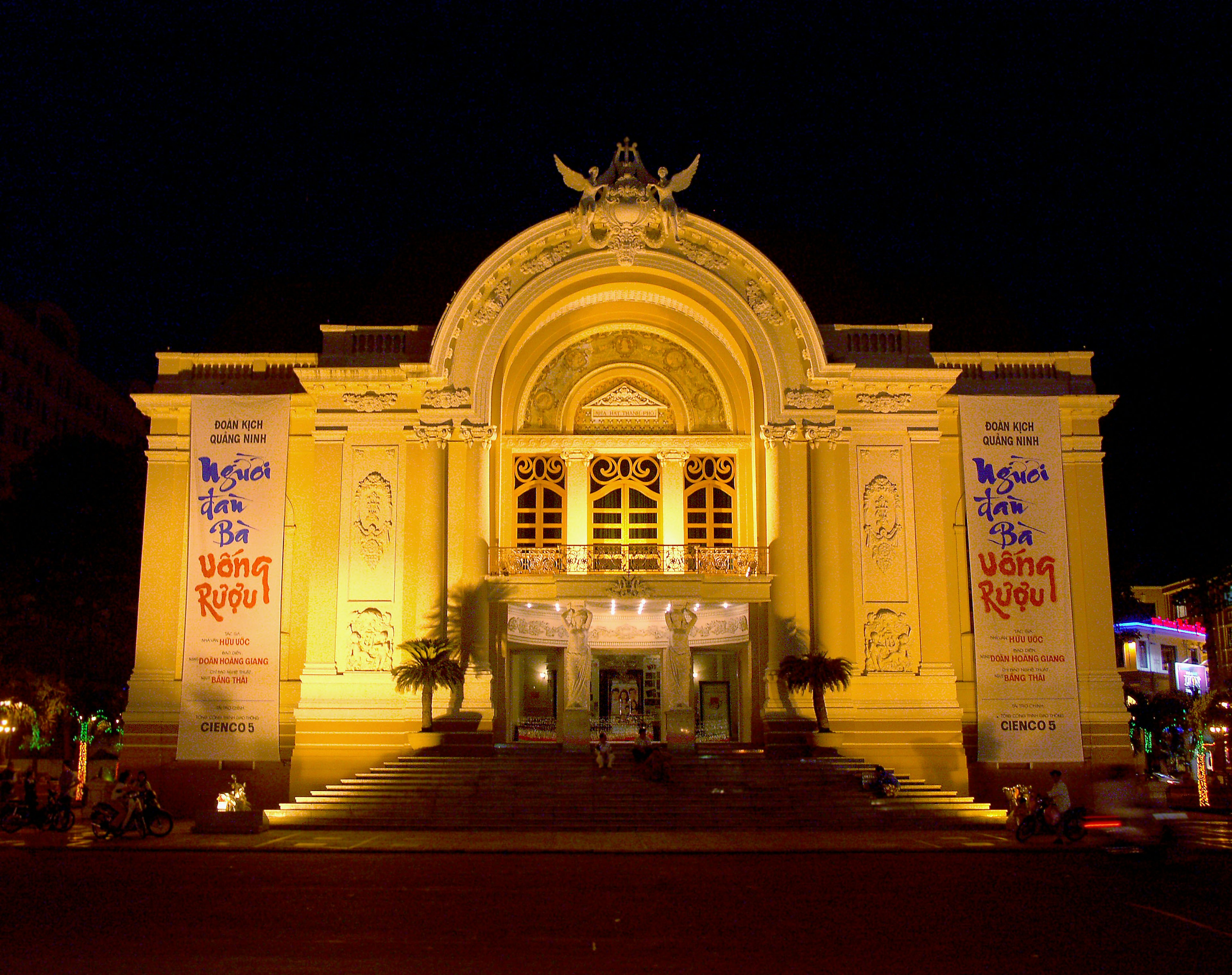 Vibrant yellow building illuminated at night