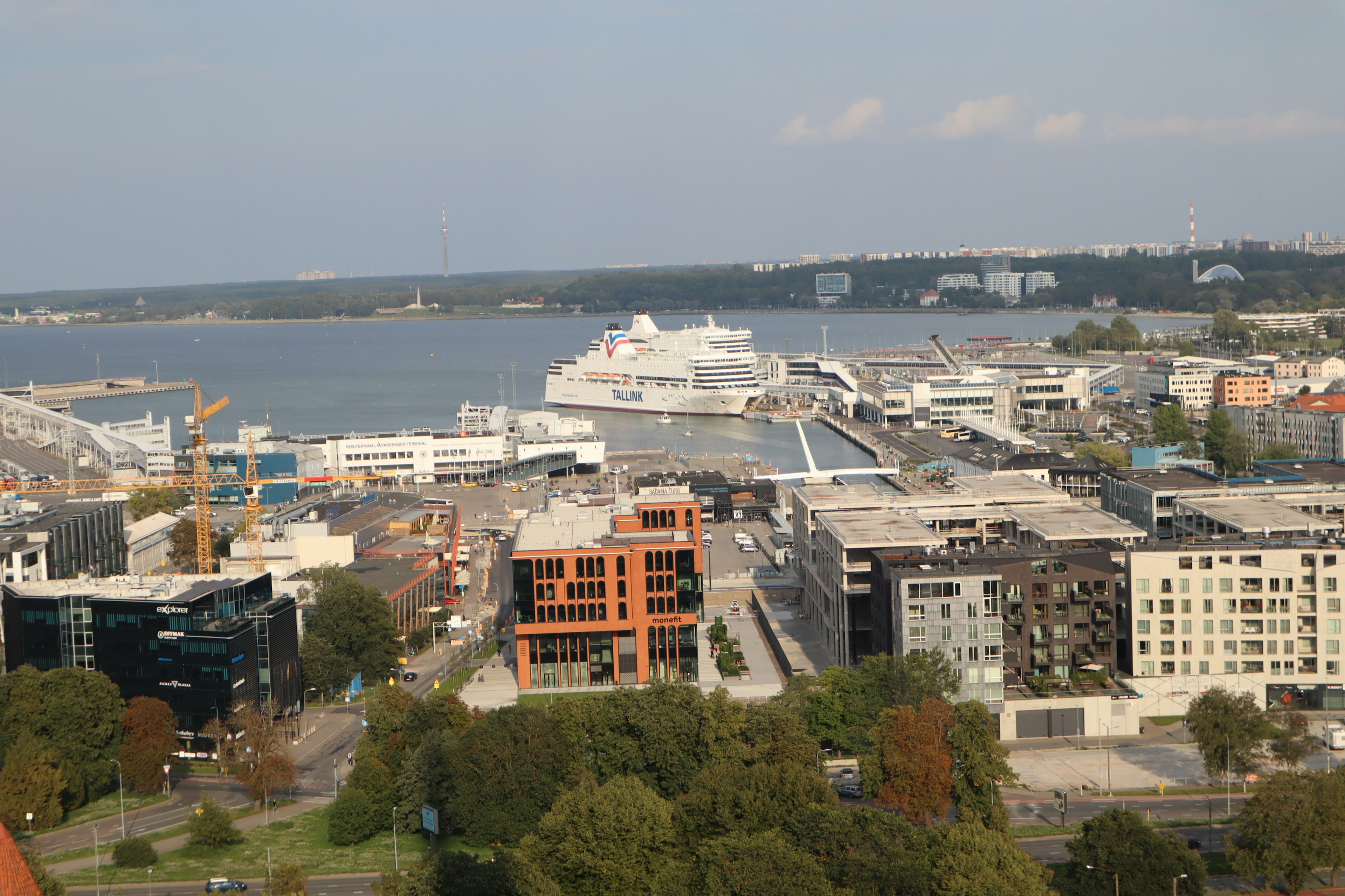 Aerial view of a harbor and cityscape with modern buildings