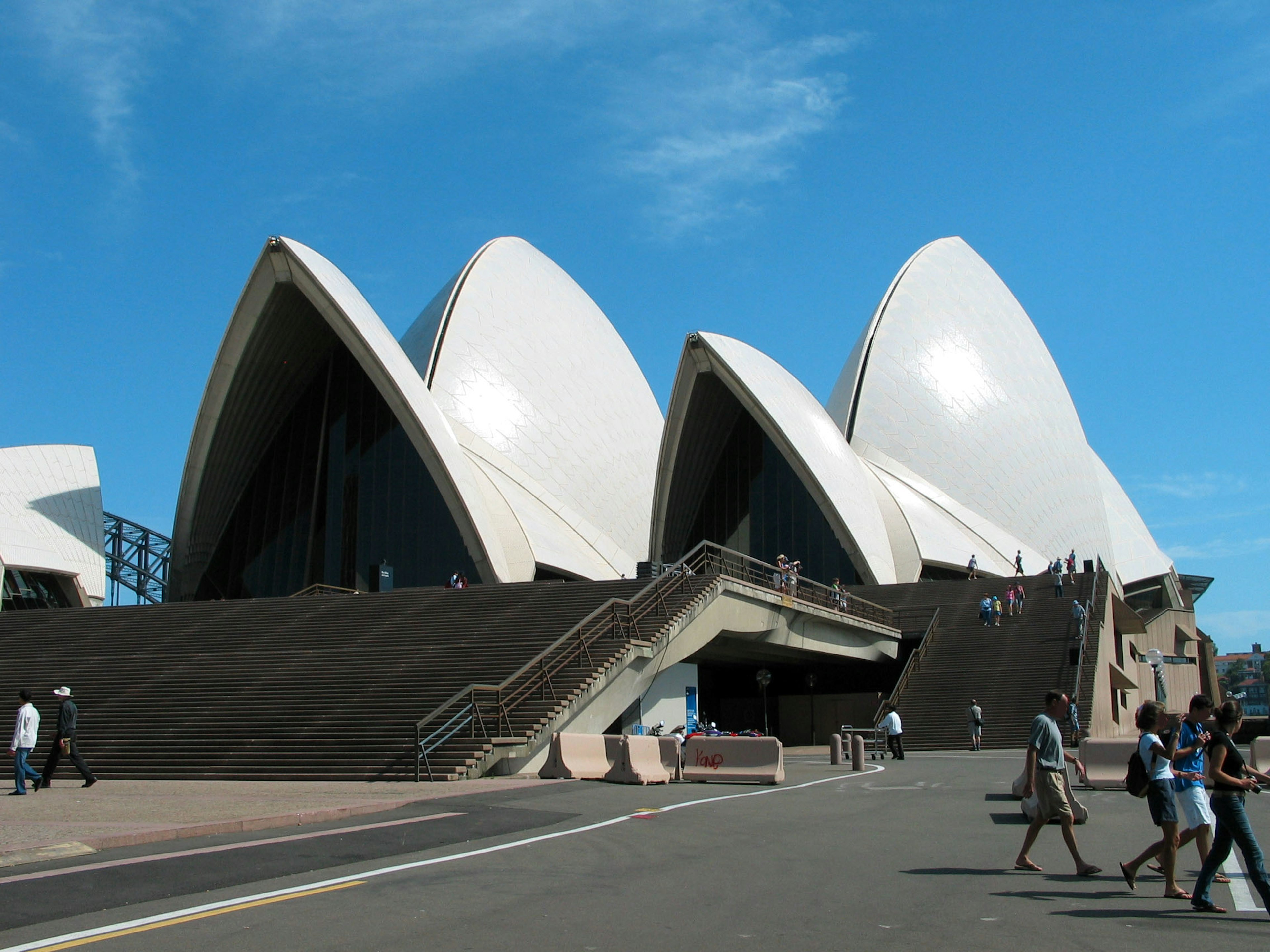 Sydney Opera House with unique white sails against a blue sky