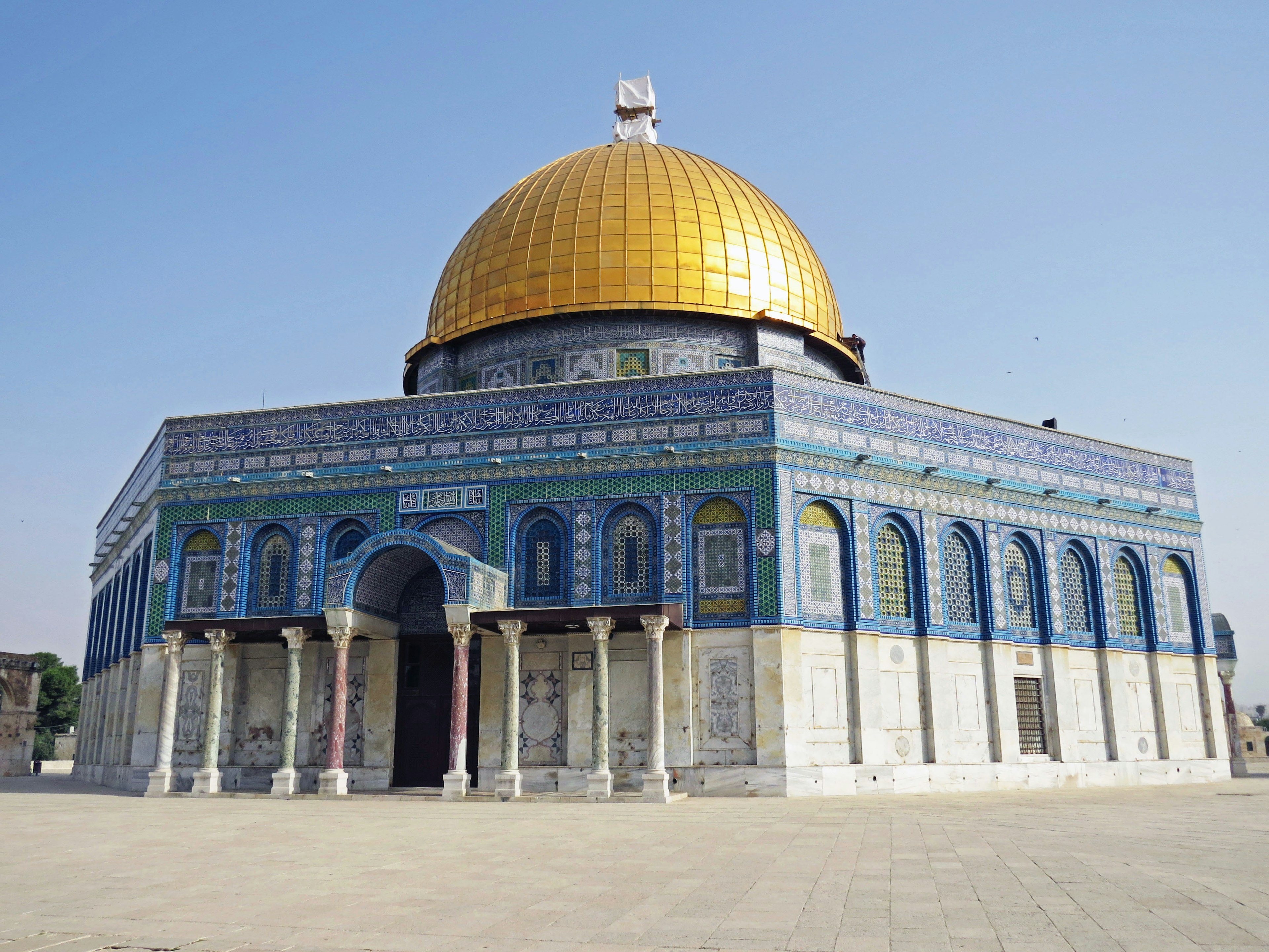 Exterior view of the Al-Aqsa Mosque with a golden dome