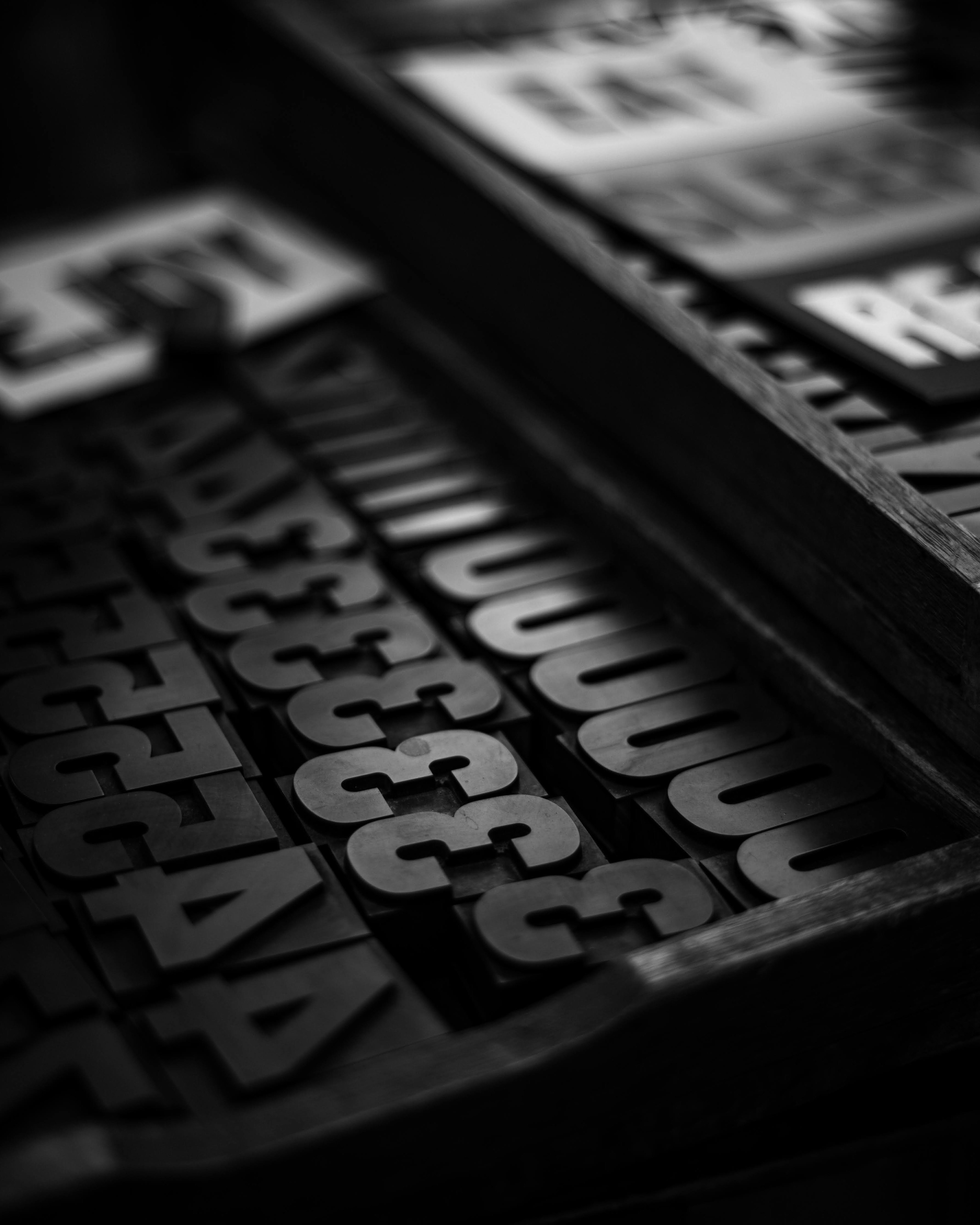 Image of black and white printing type blocks arranged