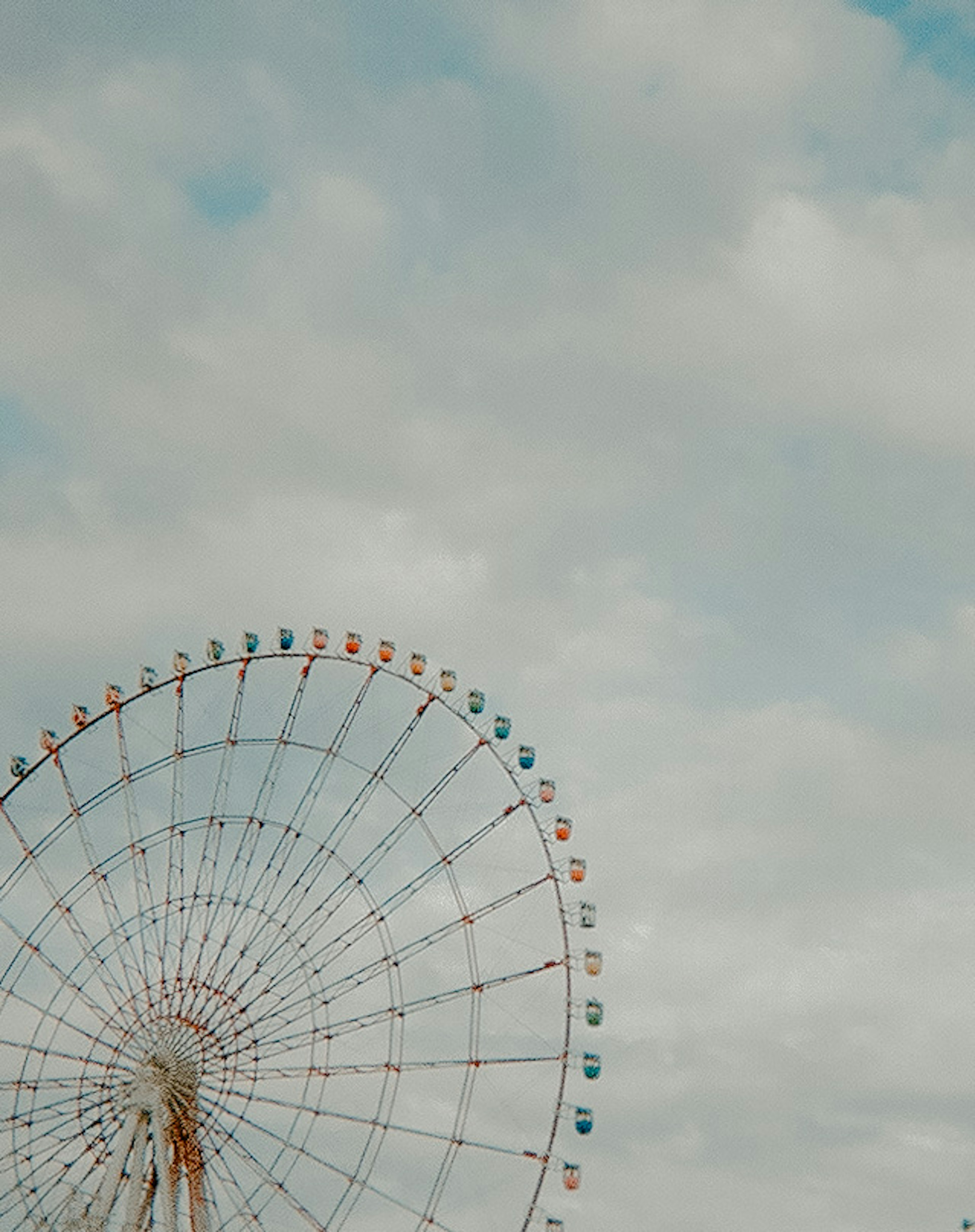 Ferris wheel against a cloudy sky