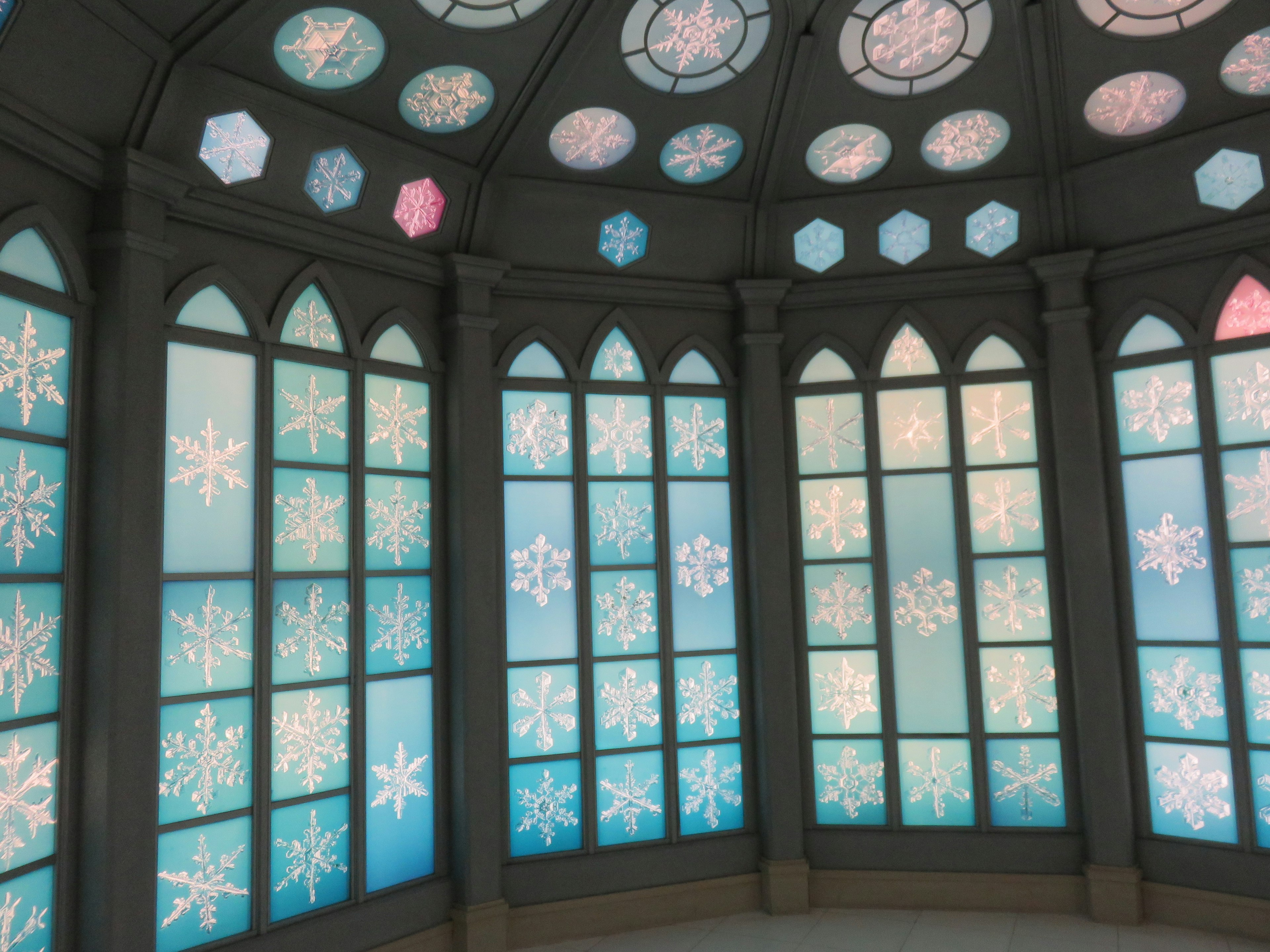 Beautiful room with blue snowflake designs on the windows