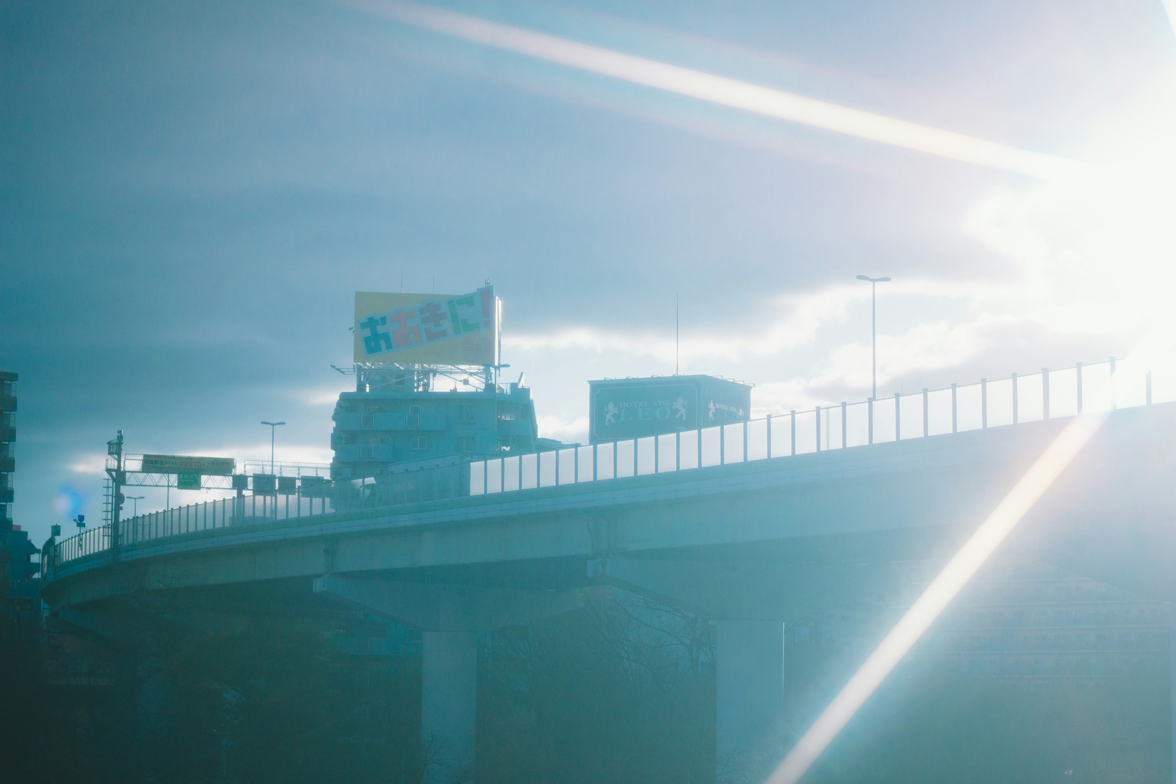 Highway scene with bright sunlight and blue sky