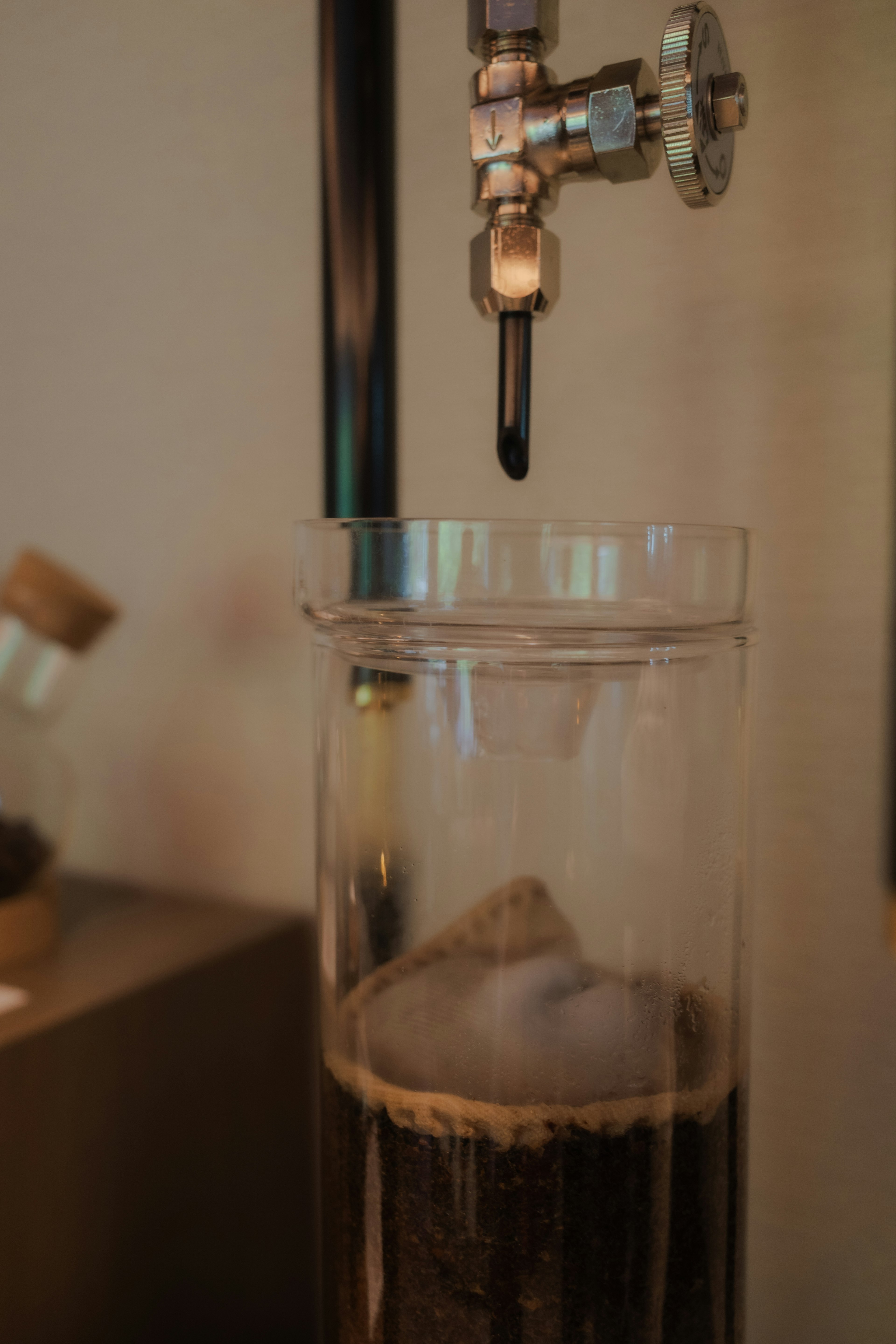 Image showing a transparent container with layers of coffee and water