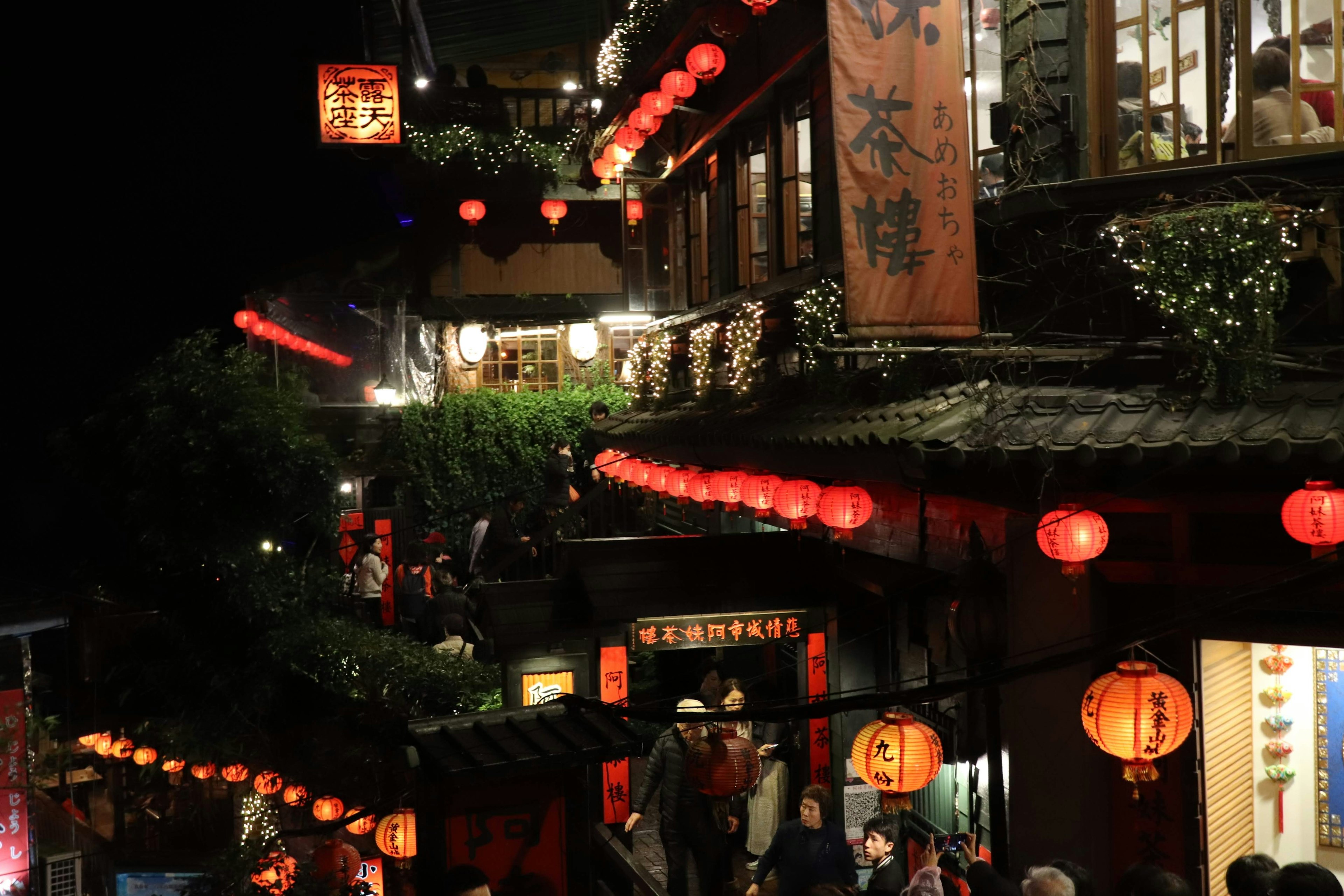 Night scene of a historic street with red lanterns