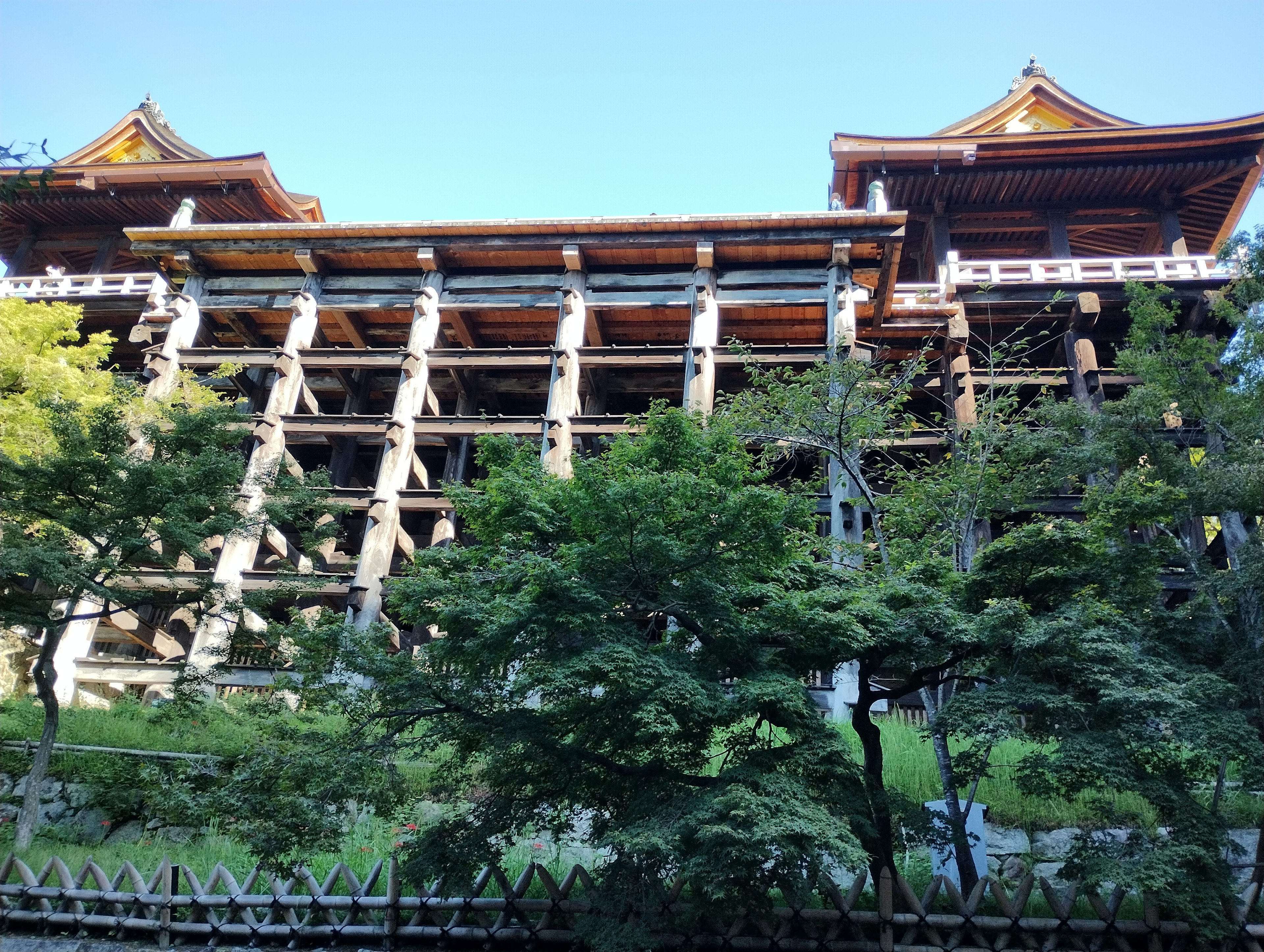 Tall wooden temple structure showcasing intricate architecture