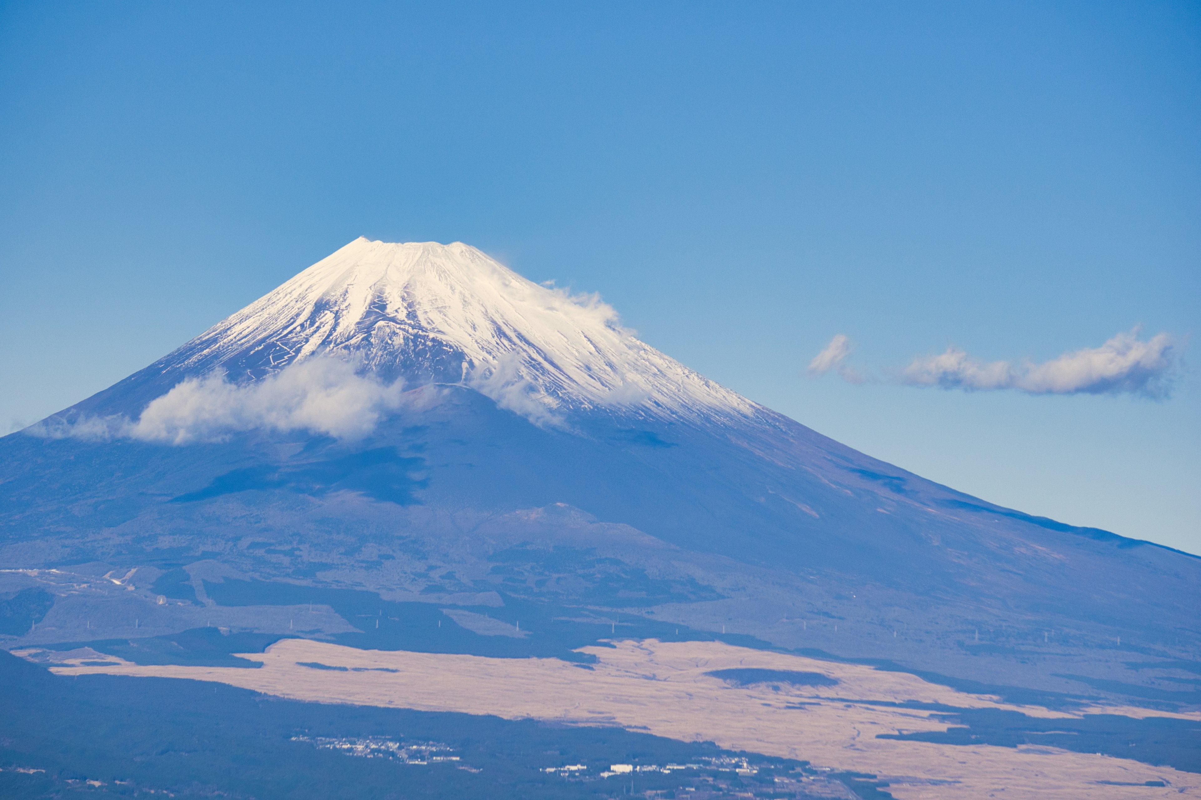 Snow-capped Mount Fuji against a clear blue sky