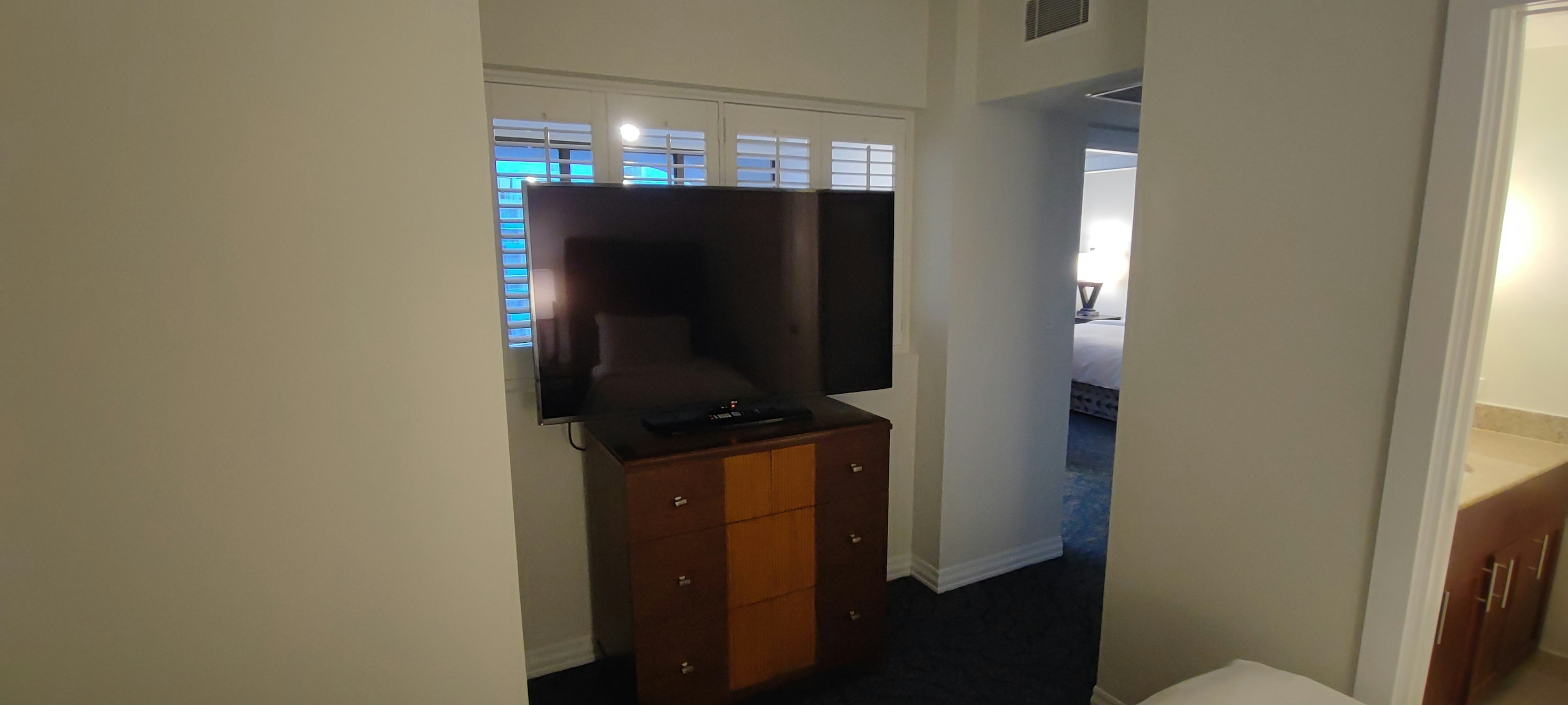 Interior view featuring a television and wooden dresser