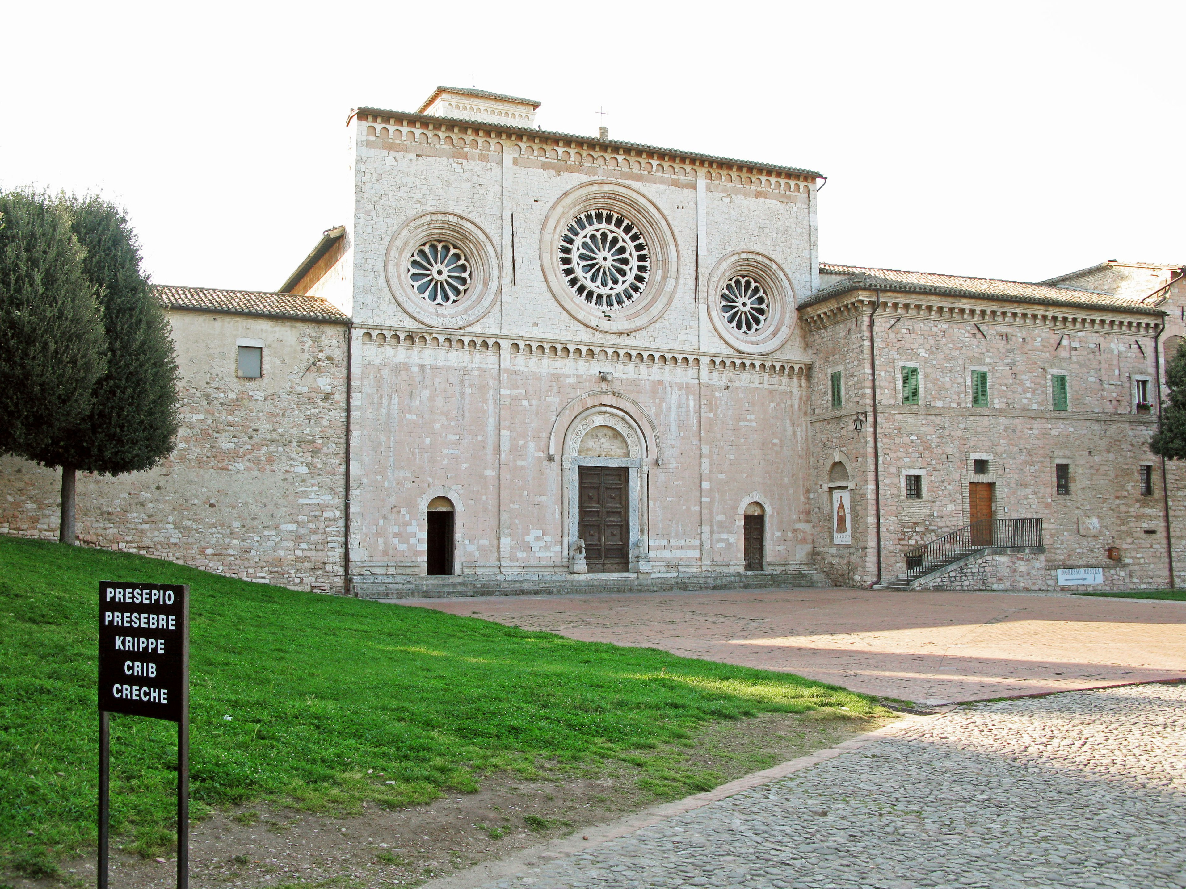 Beautiful stone building with circular windows of the Basilica of Saint Francis