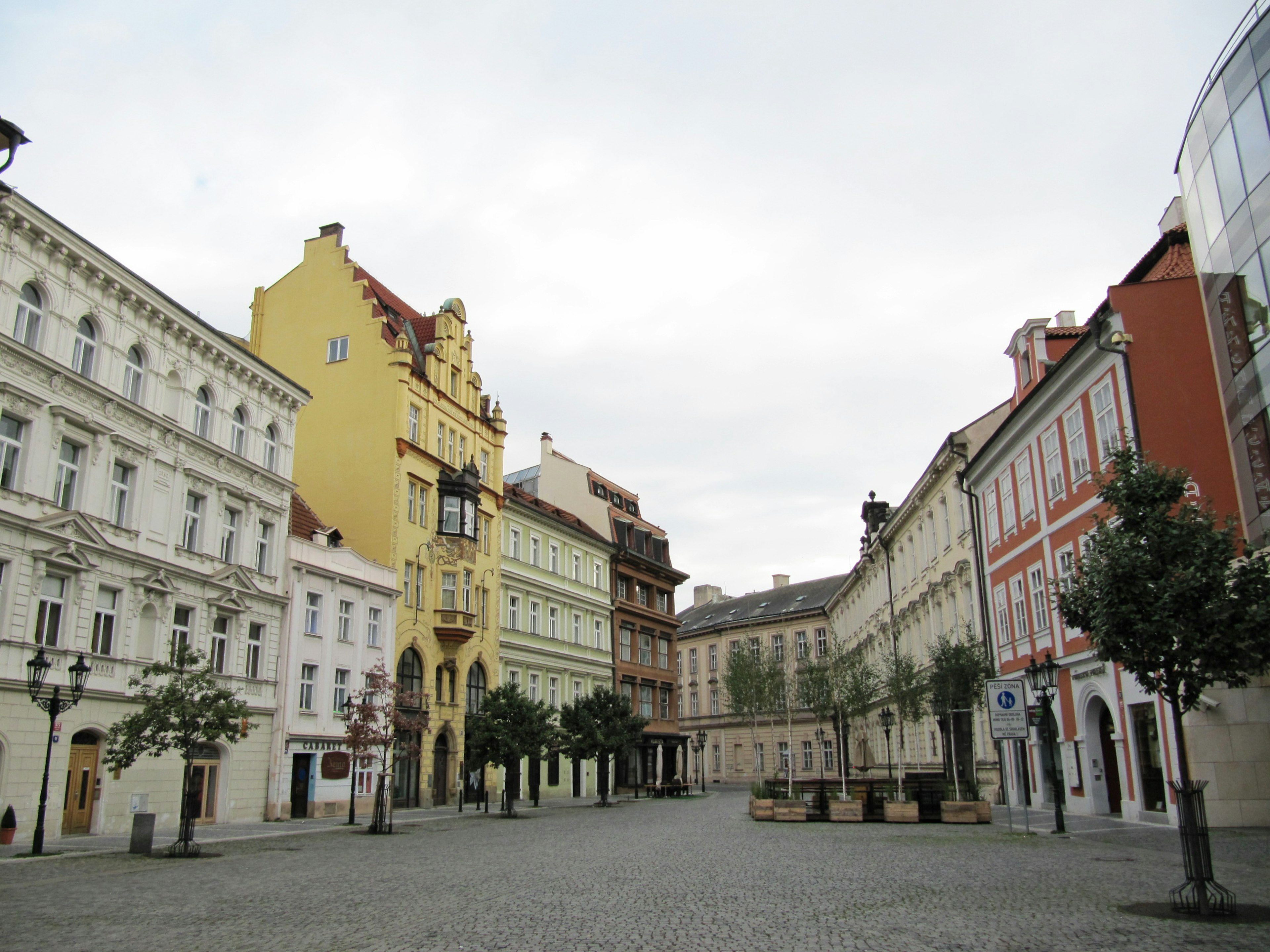 Scenic square with colorful buildings and cobblestone pavement