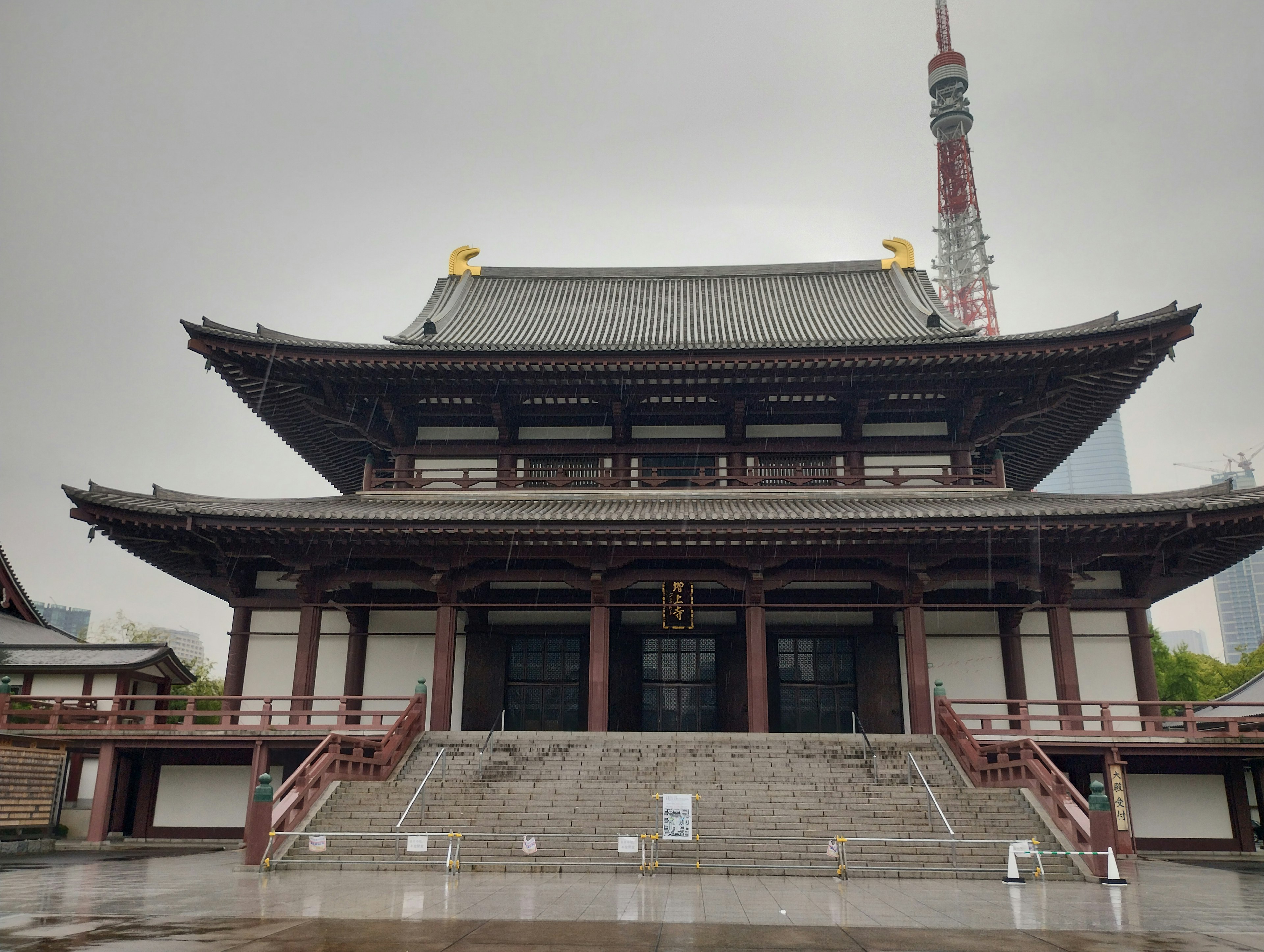 Traditional temple architecture with Tokyo Tower in the background