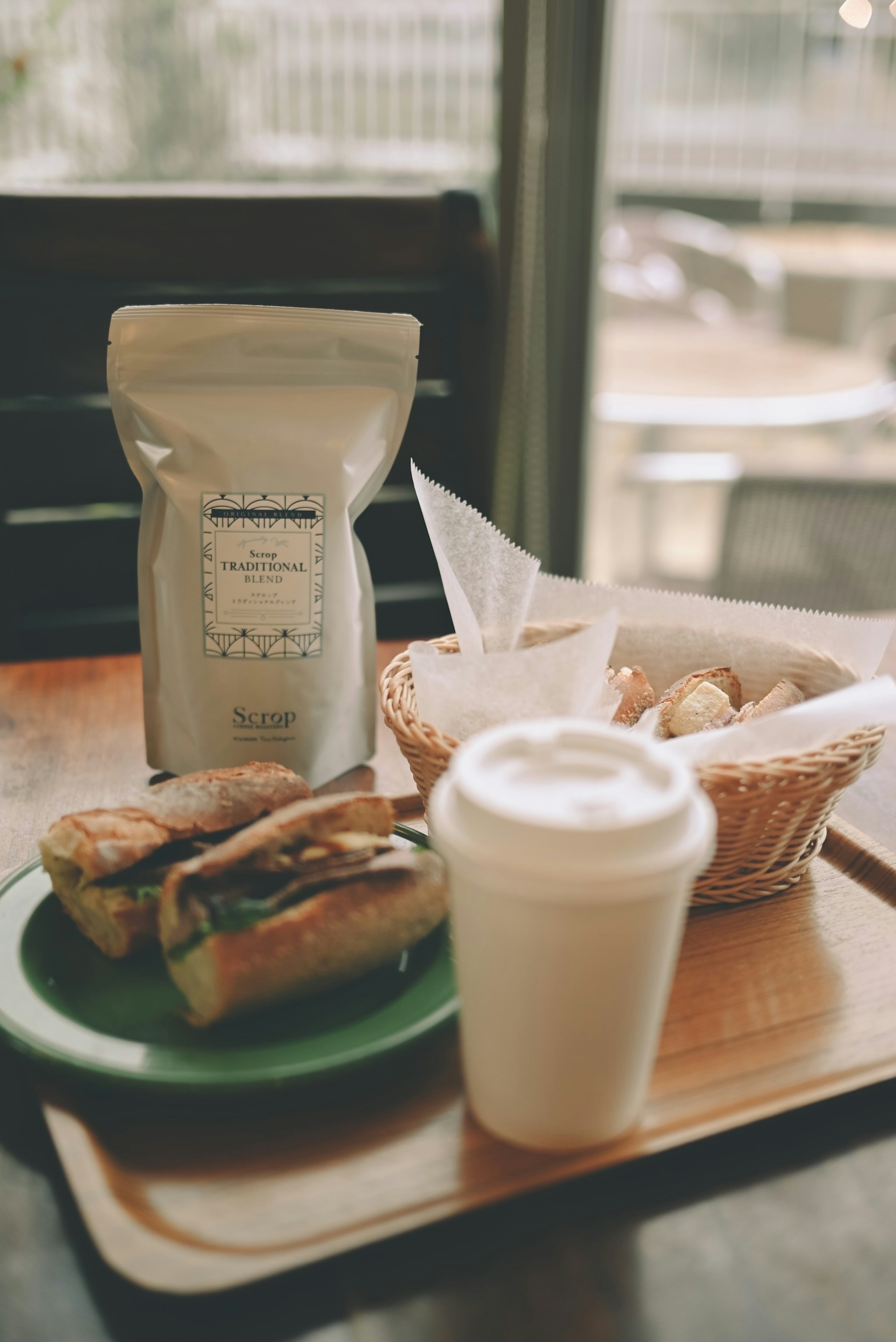 Coffee and sandwich plate on a cafe table