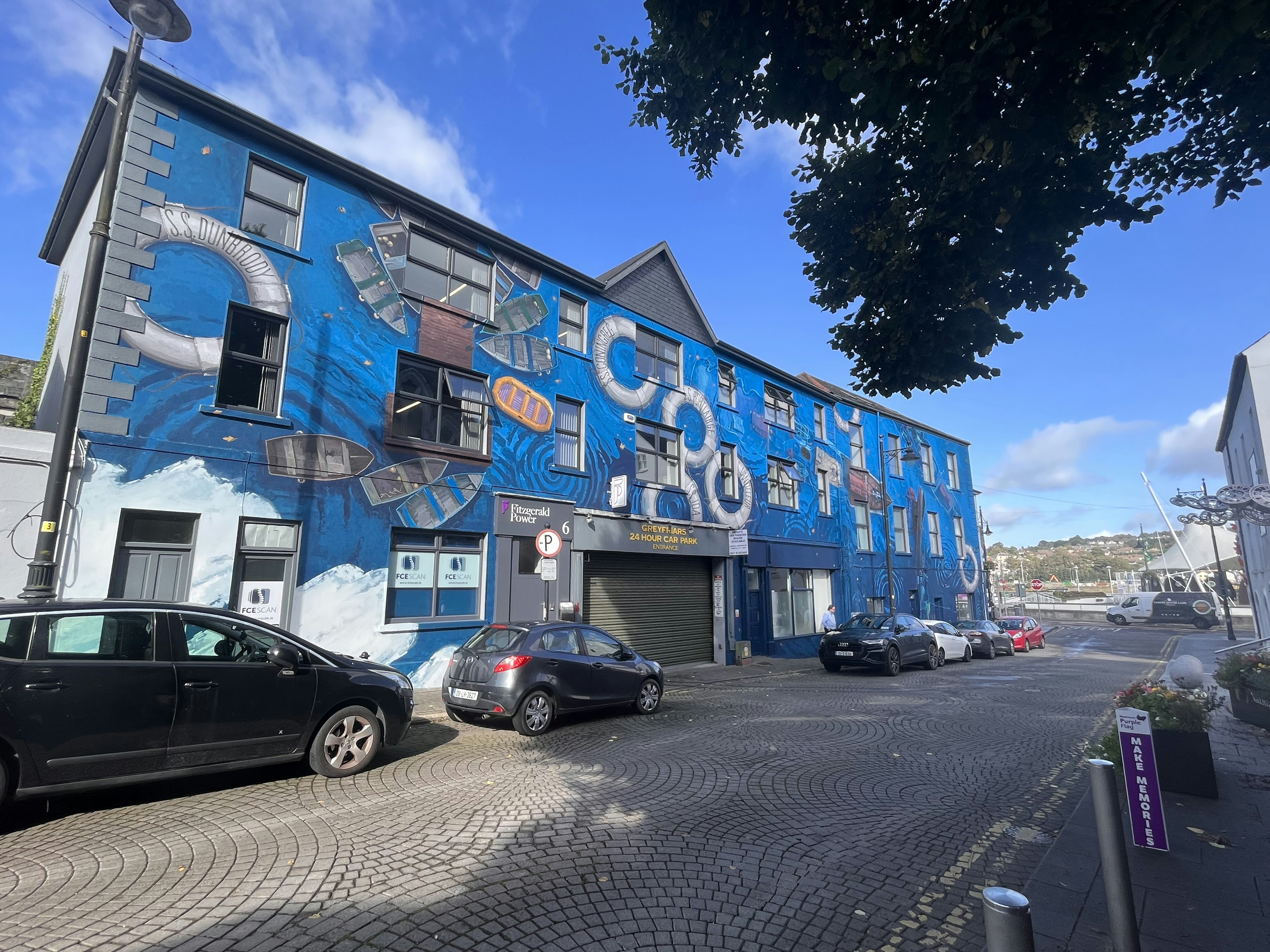 Exterior of a building with blue gear graffiti