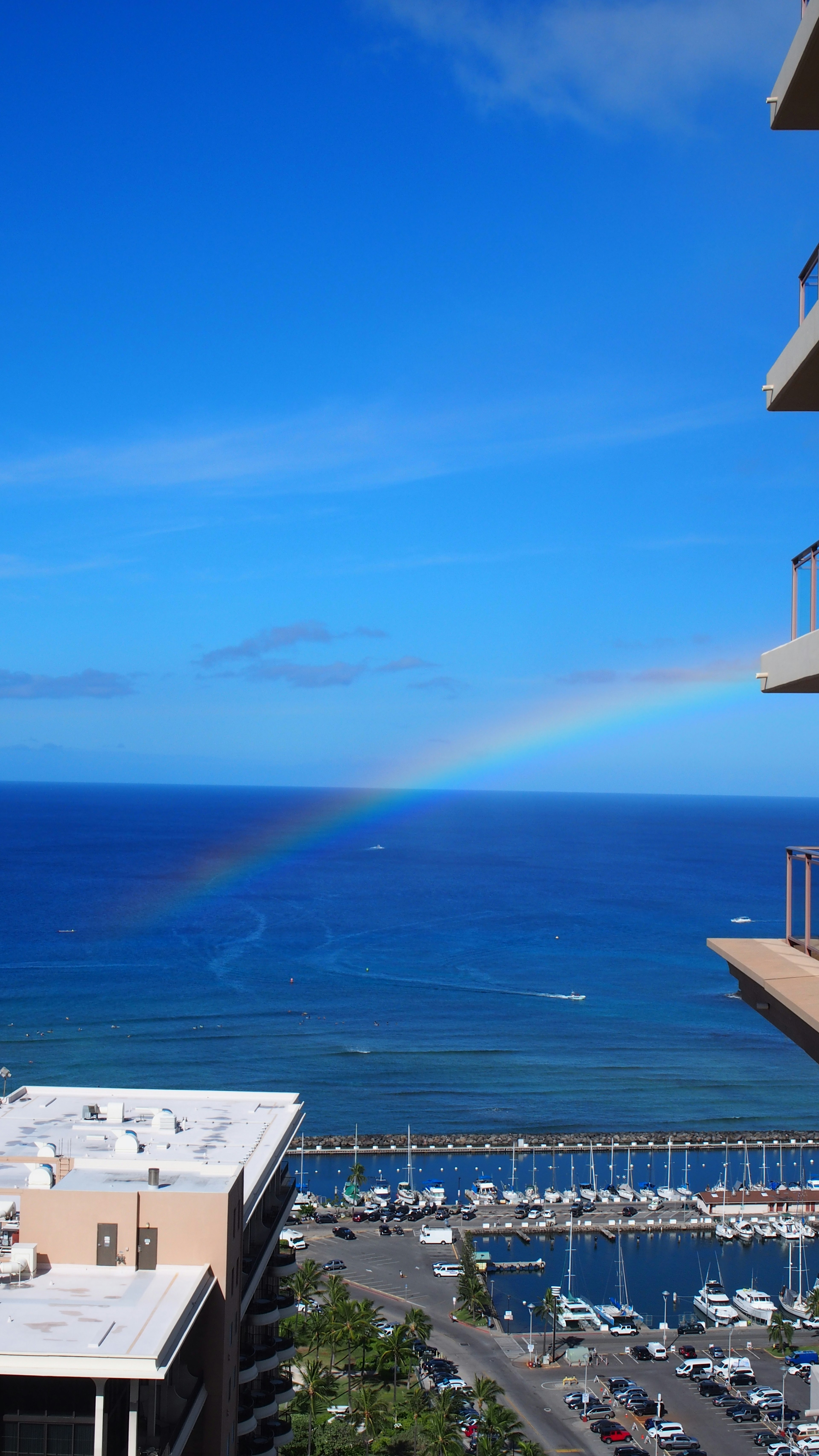 Coastal view featuring a blue ocean and a rainbow