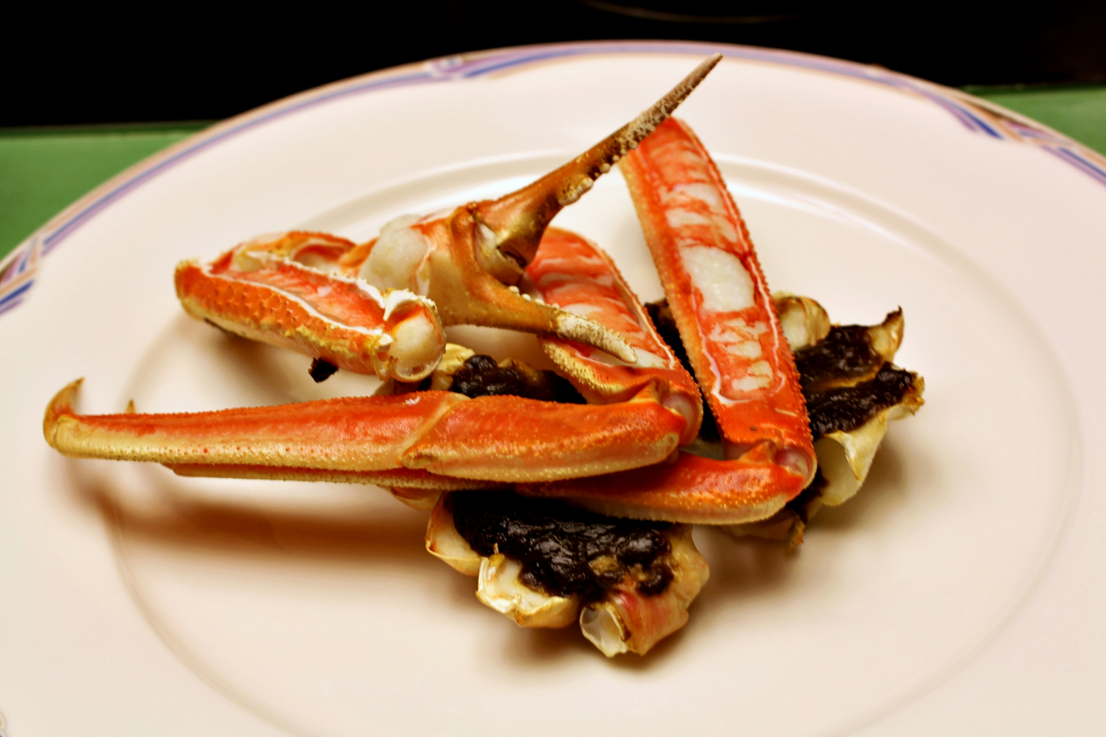 Plate featuring crab legs and shellfish arrangement