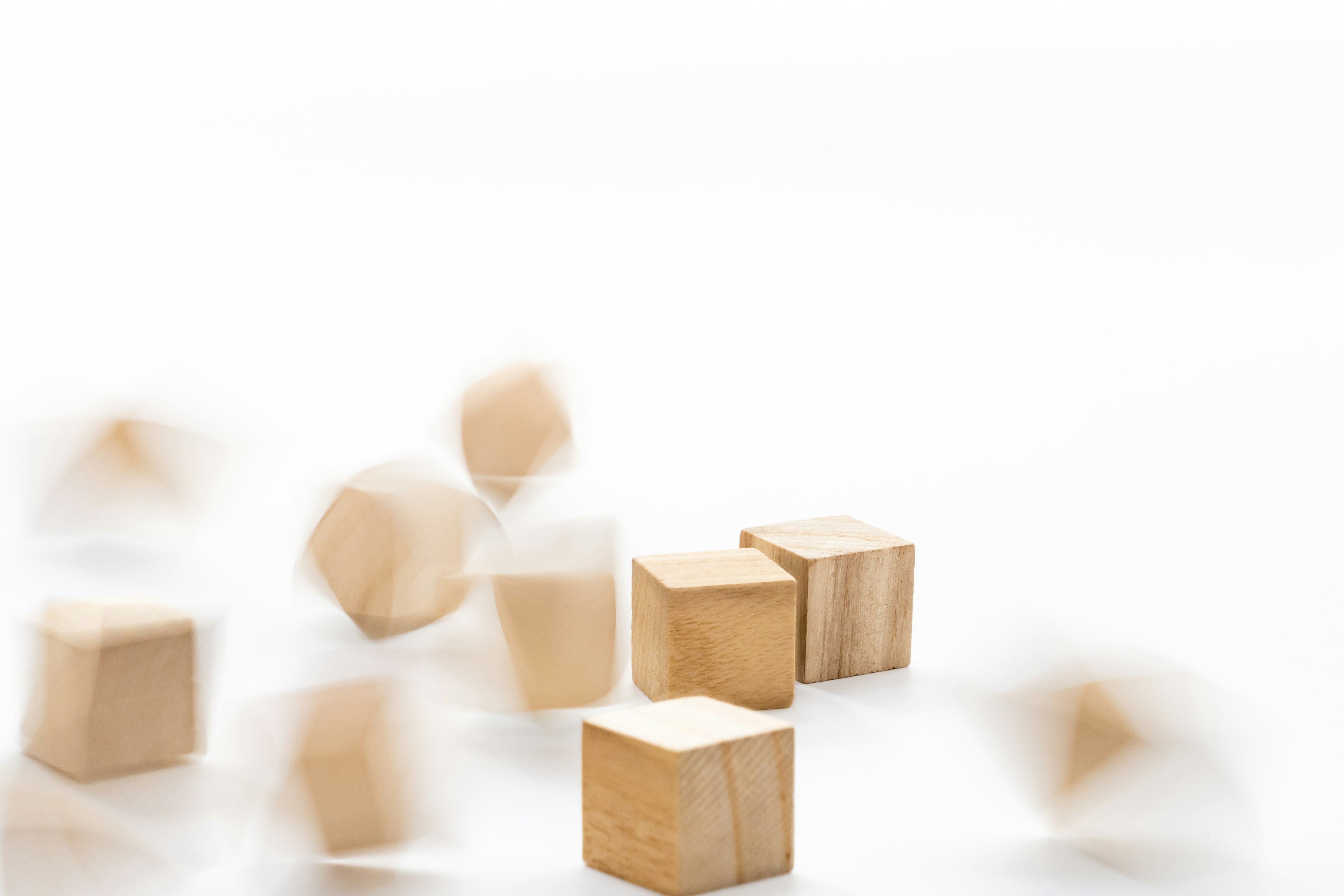 Image of wooden blocks in motion with a blurred background