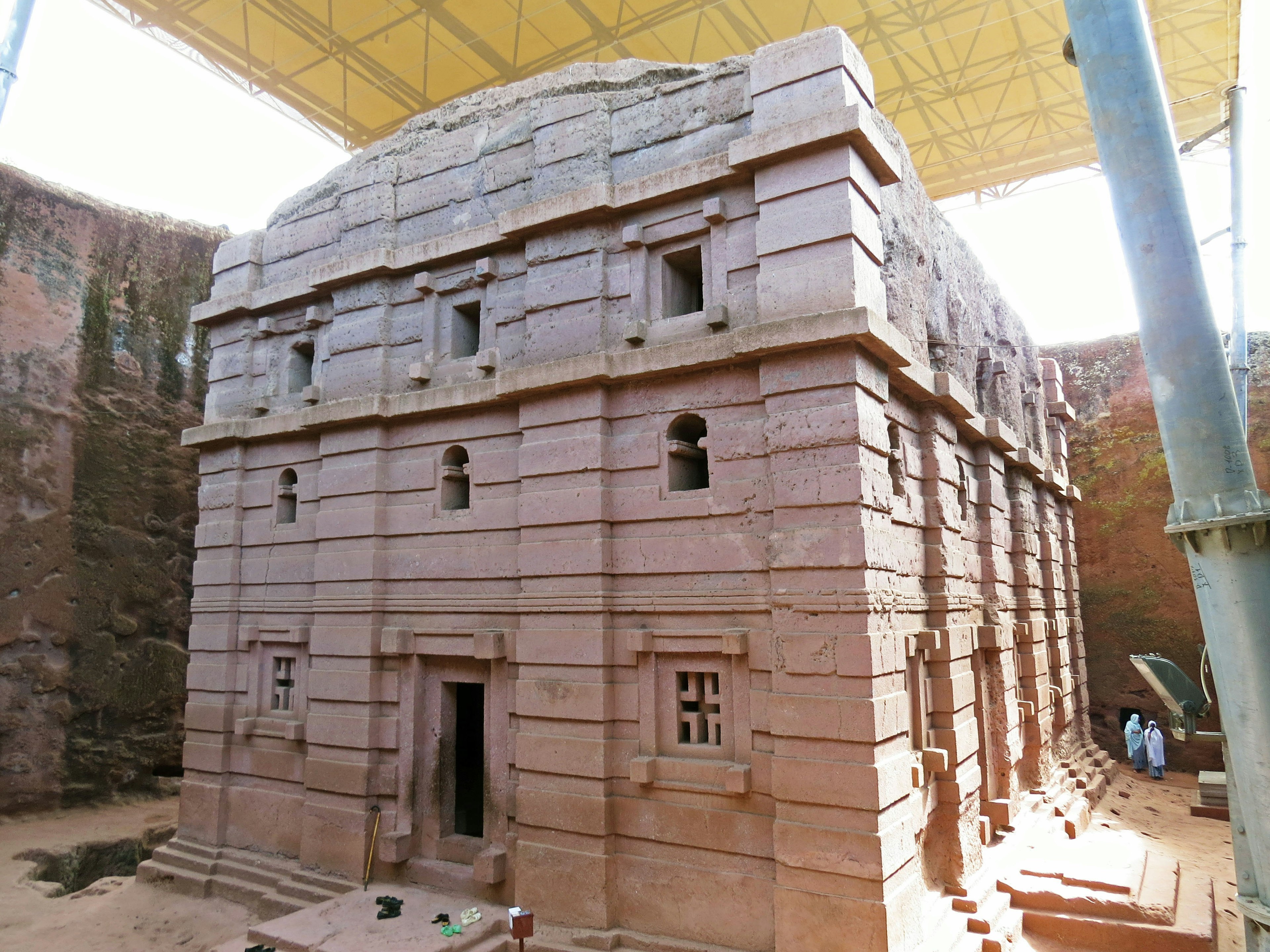 Ancient stone structure under a protective roof