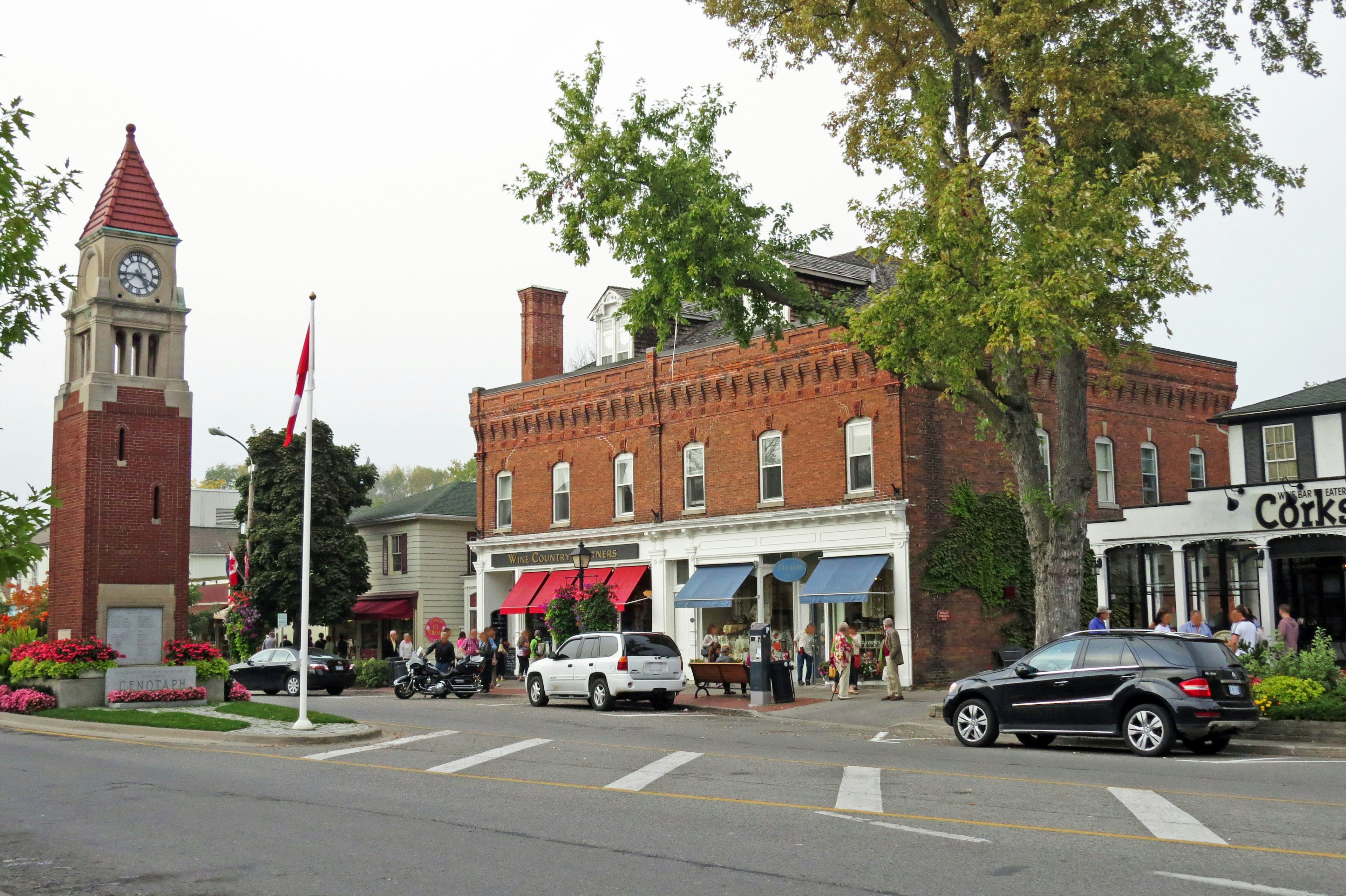 Town scene featuring a red brick building and clock tower