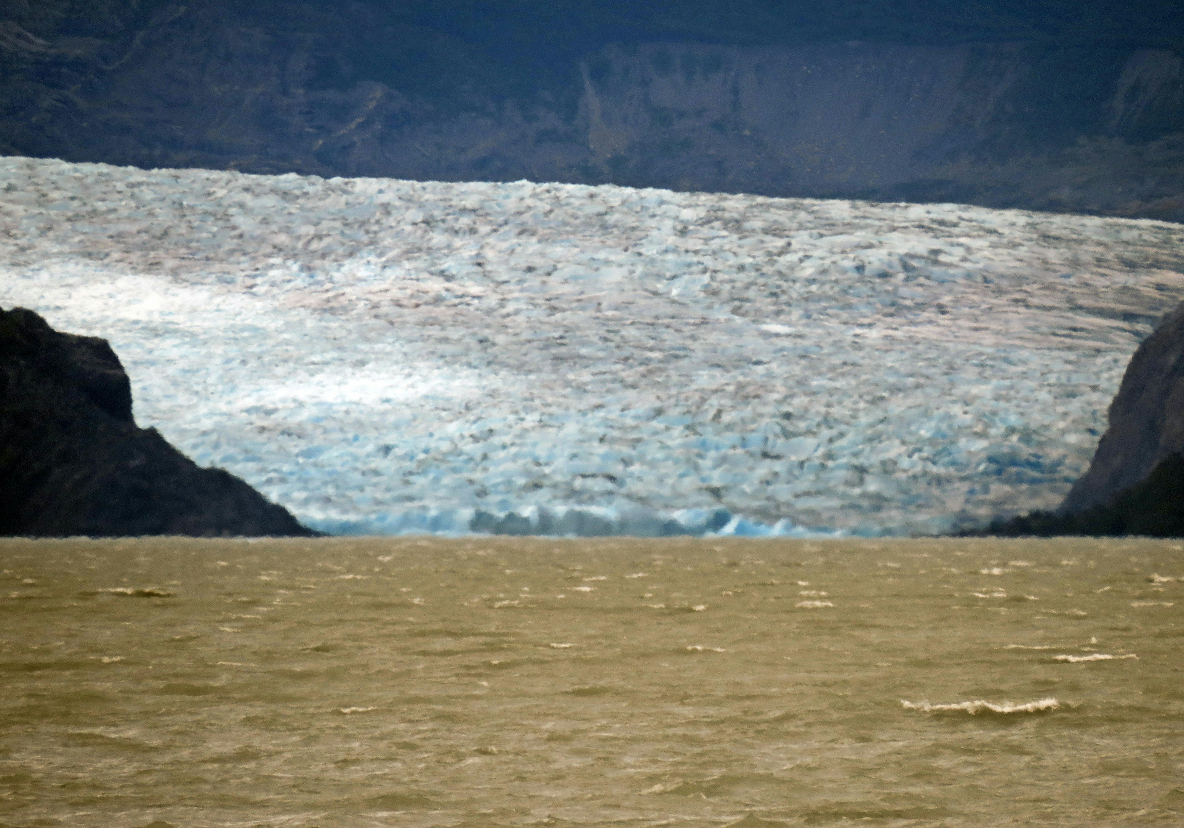 Impressive landscape featuring the contrast of a glacier and water surface