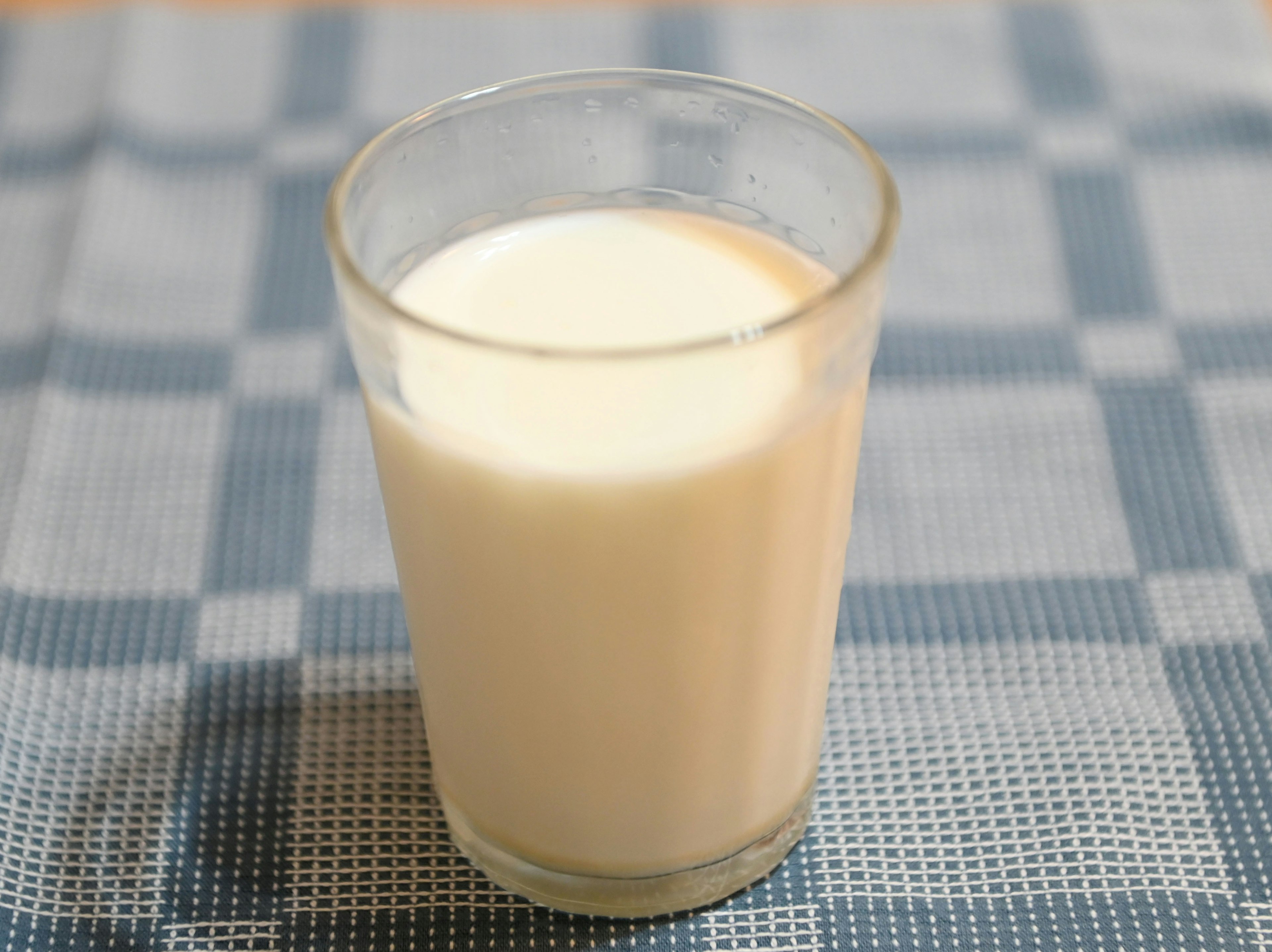 A glass of milk placed on a table