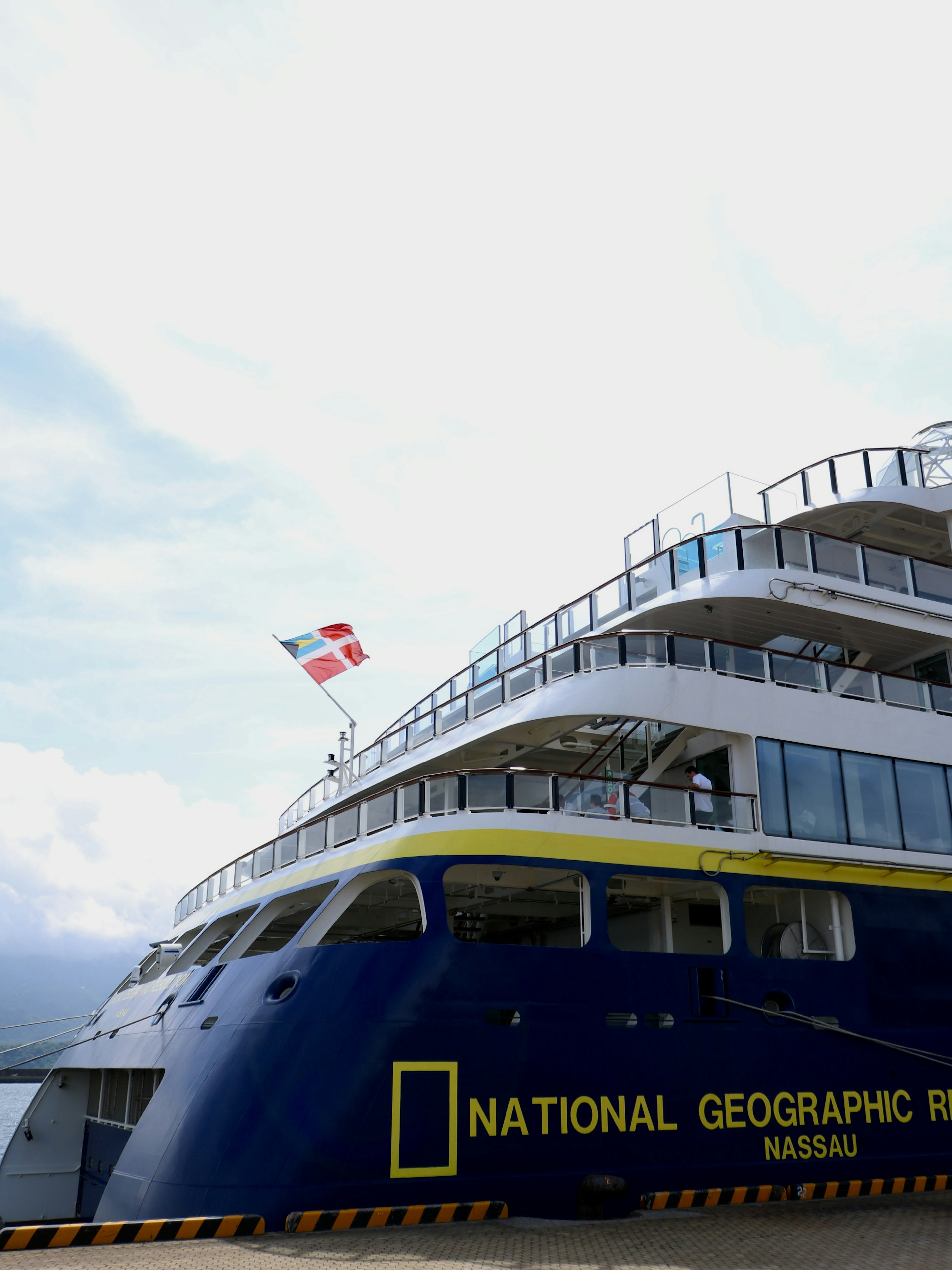 National Geographic expedition ship docked near blue waters