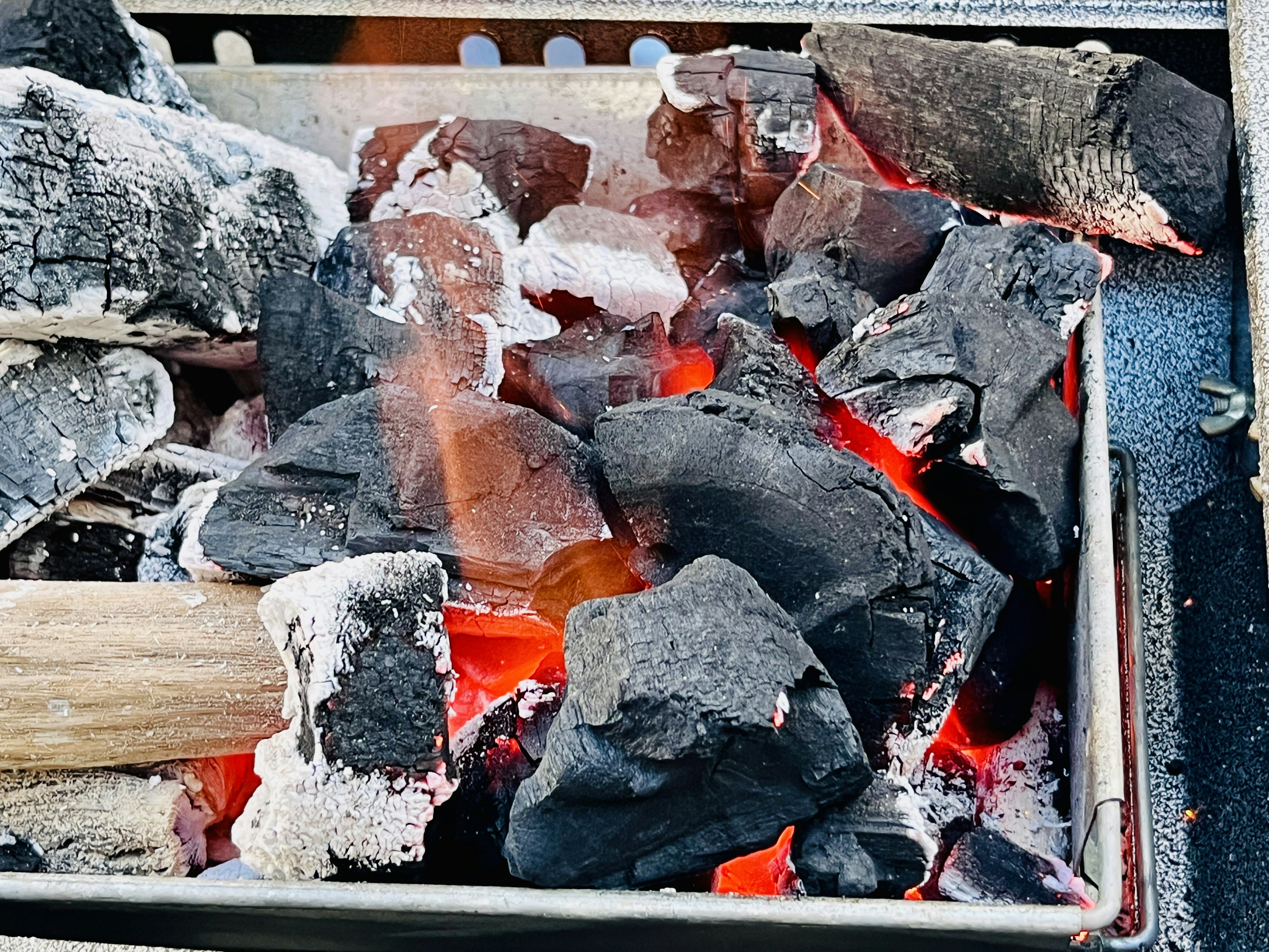 Glowing charcoal in a barbecue grill