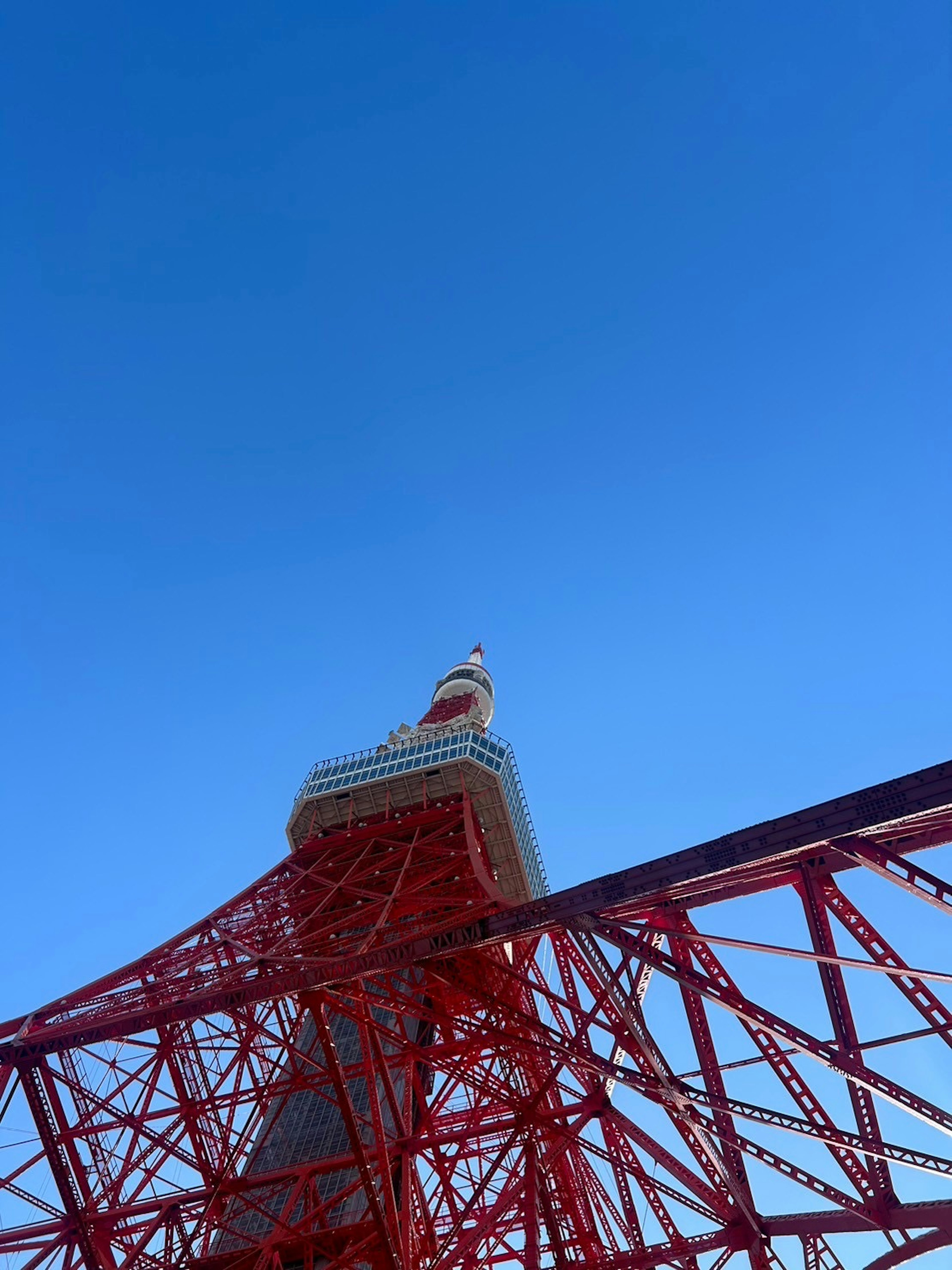 Tokyo Tower with red structure against blue sky