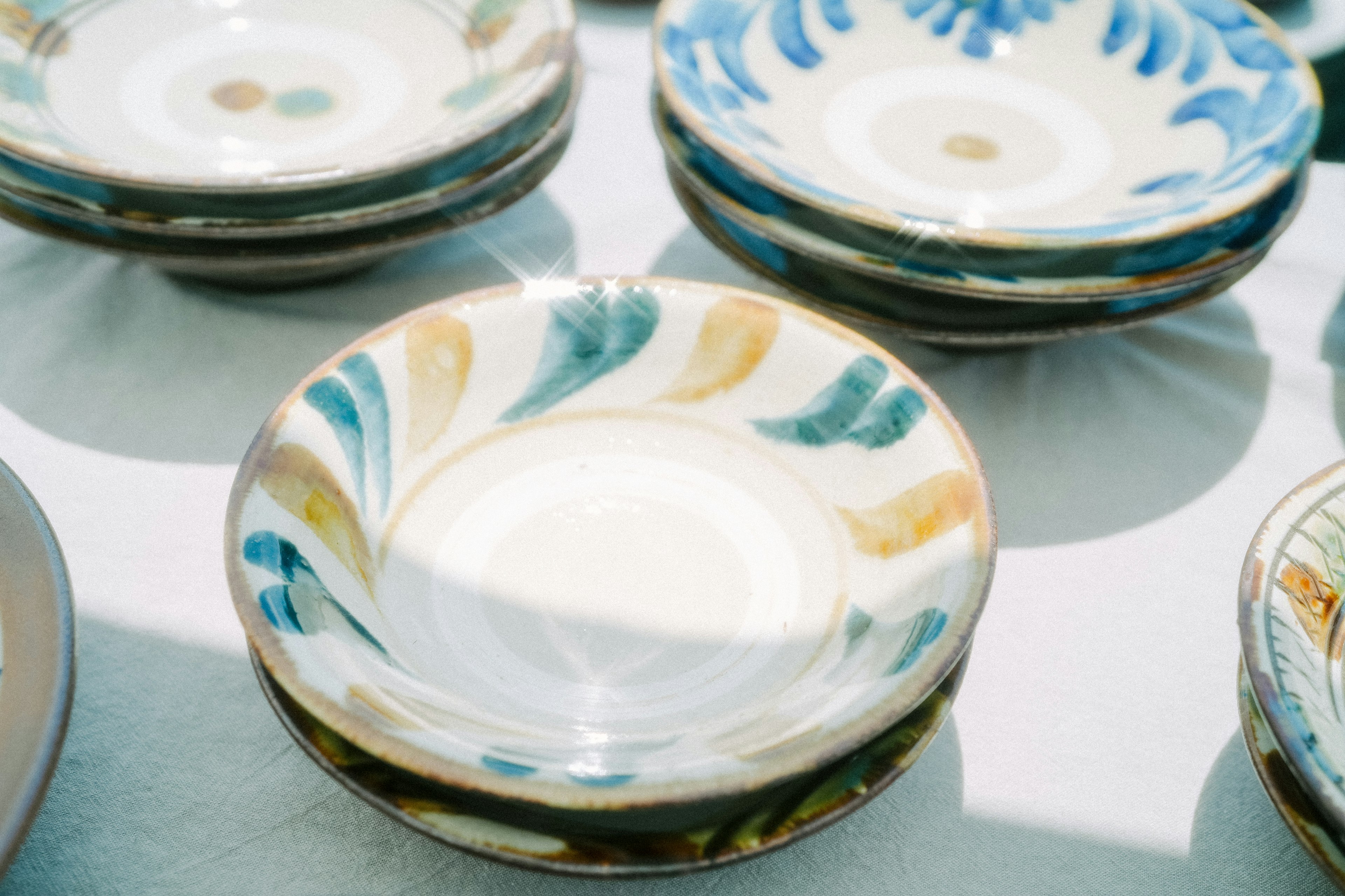 Colorful decorative ceramic plates arranged in a display