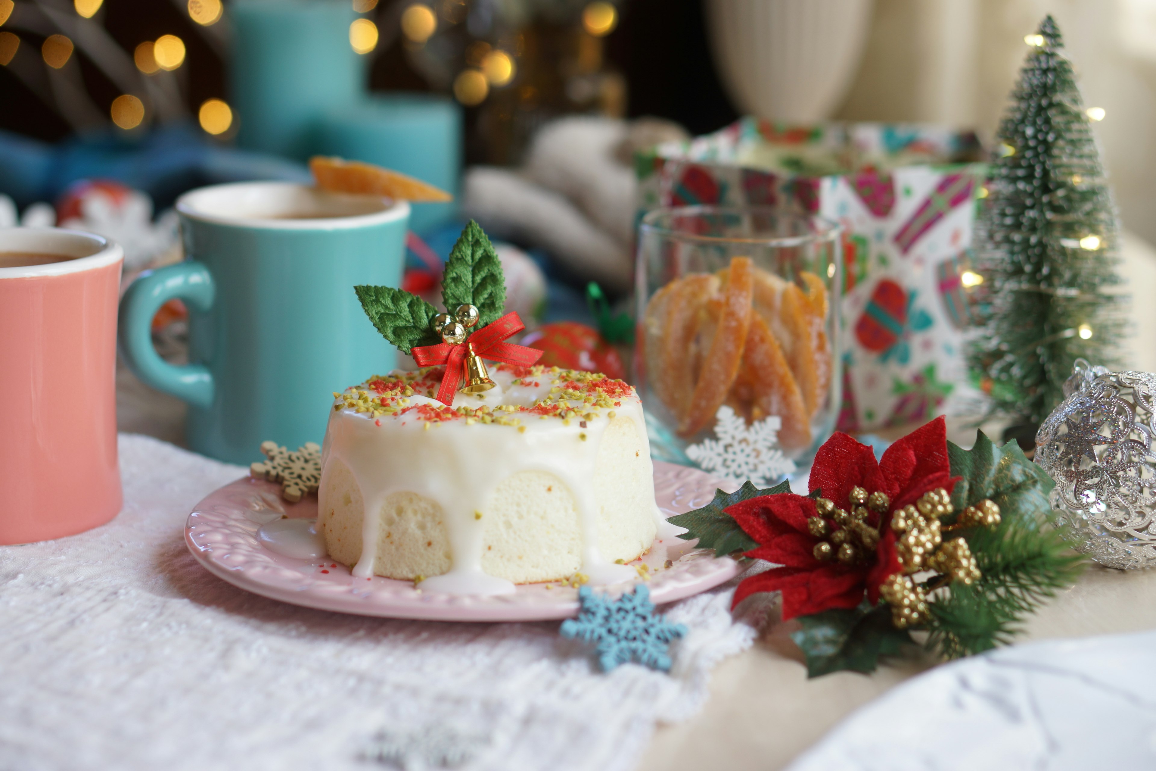 Christmas decorated table featuring cake and drinks