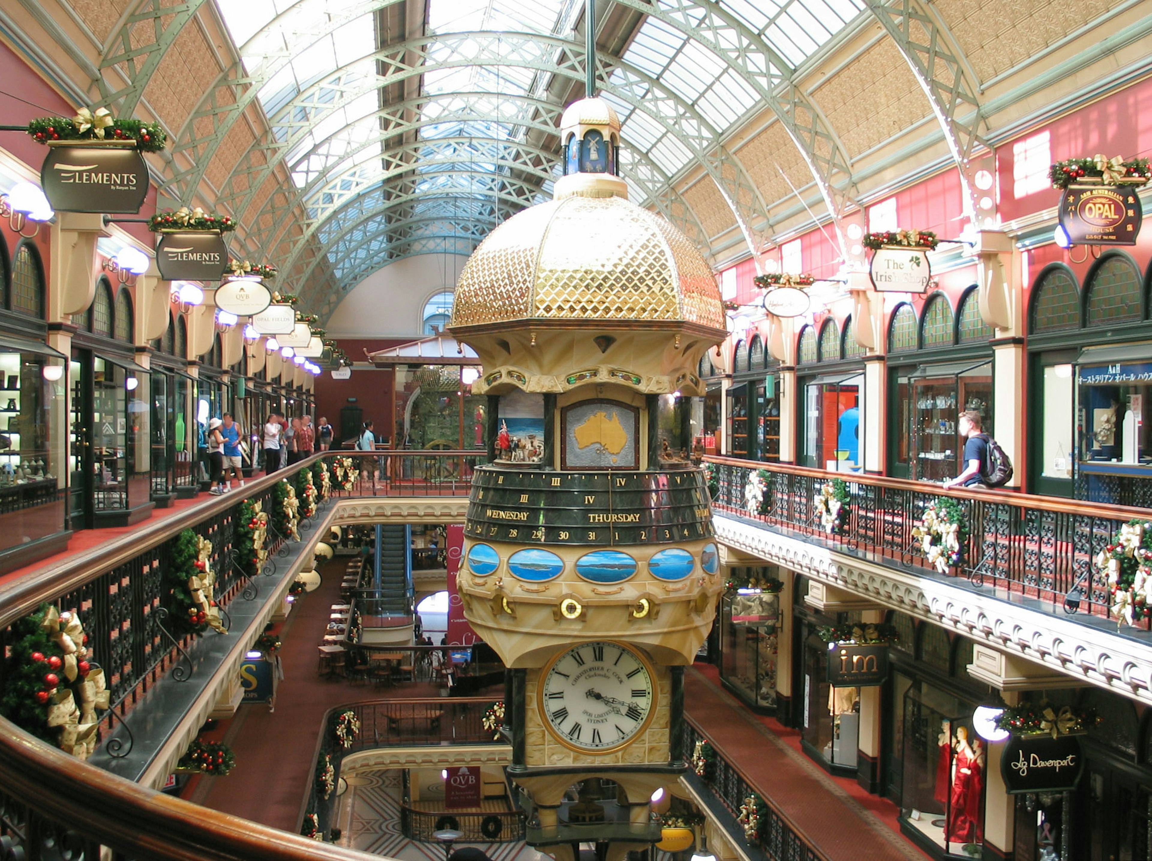 Interior of a beautiful arcade featuring a decorative clock and ornate ceiling