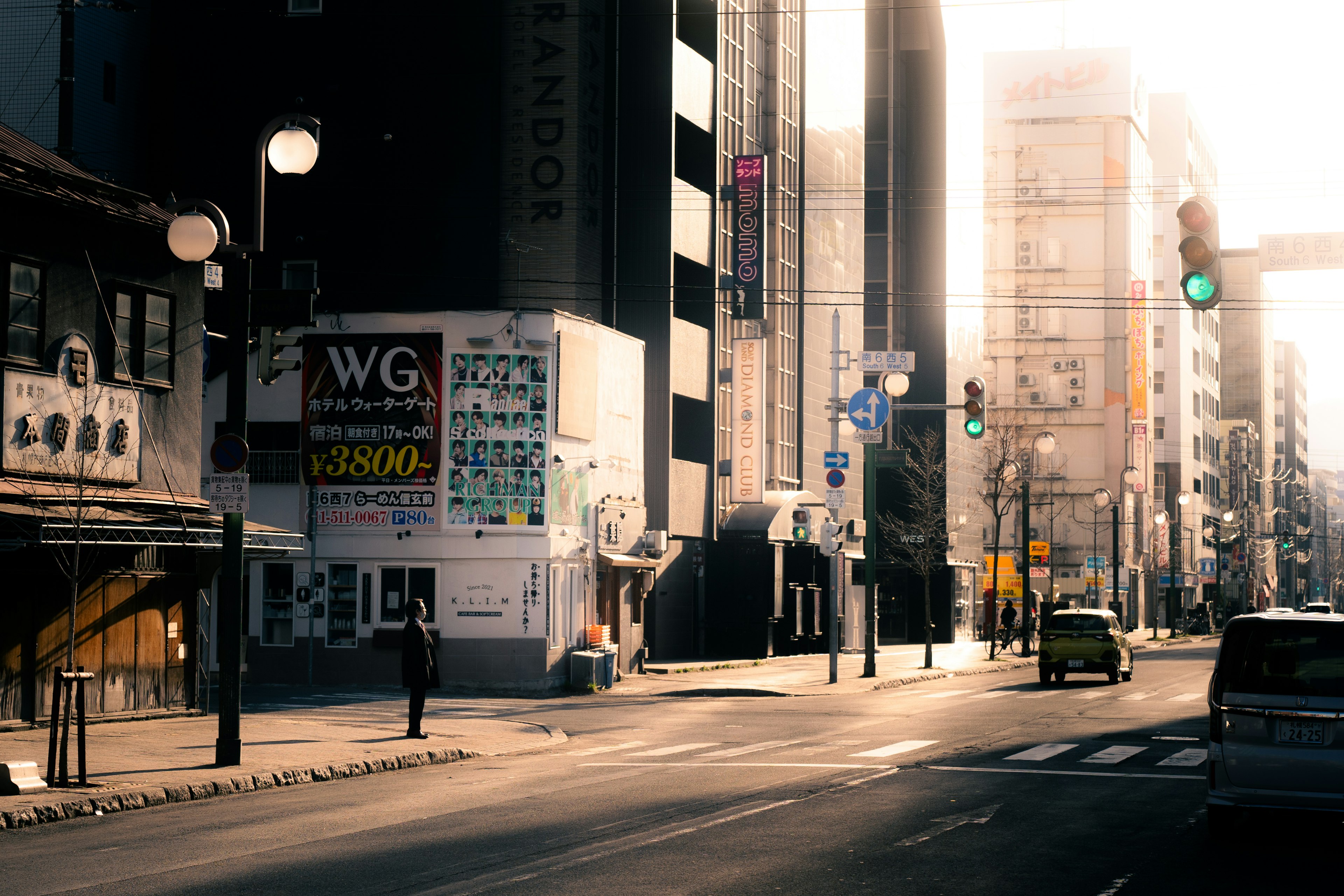 Quiet city street with a person and buildings