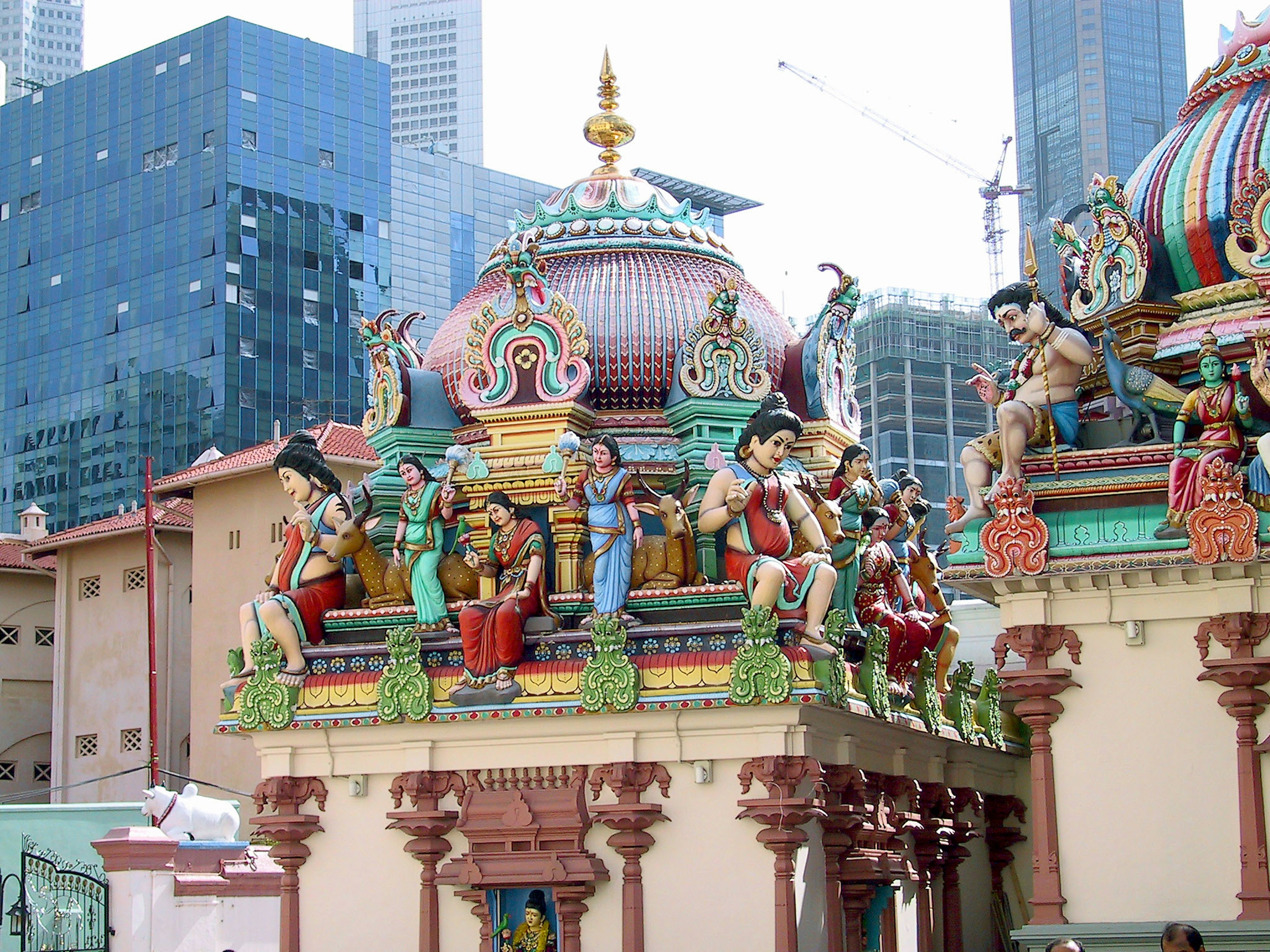 Colorful roof and sculpted deities of a Hindu temple in Singapore