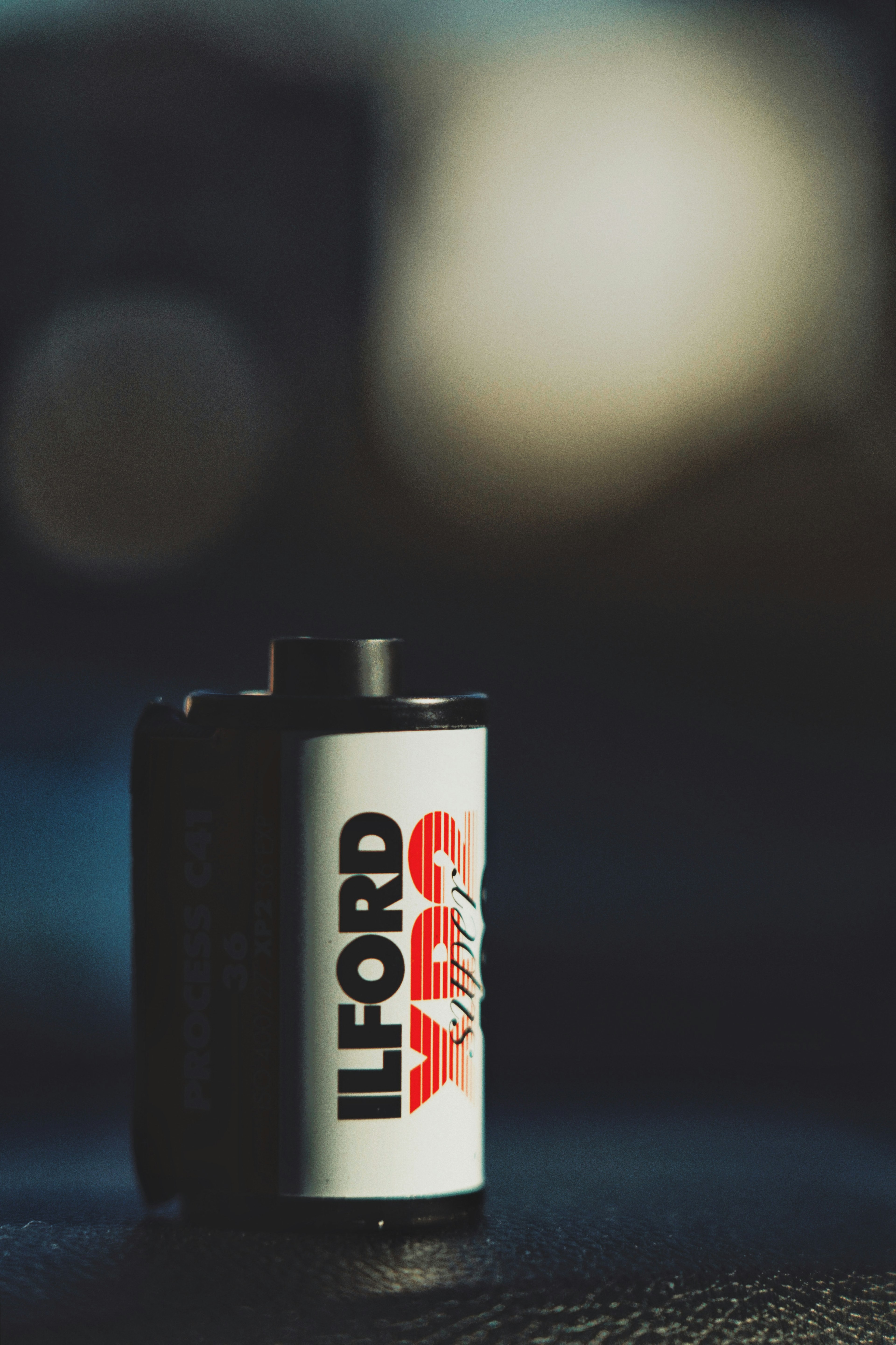 ILFORD film cartridge highlighted with a blurred background