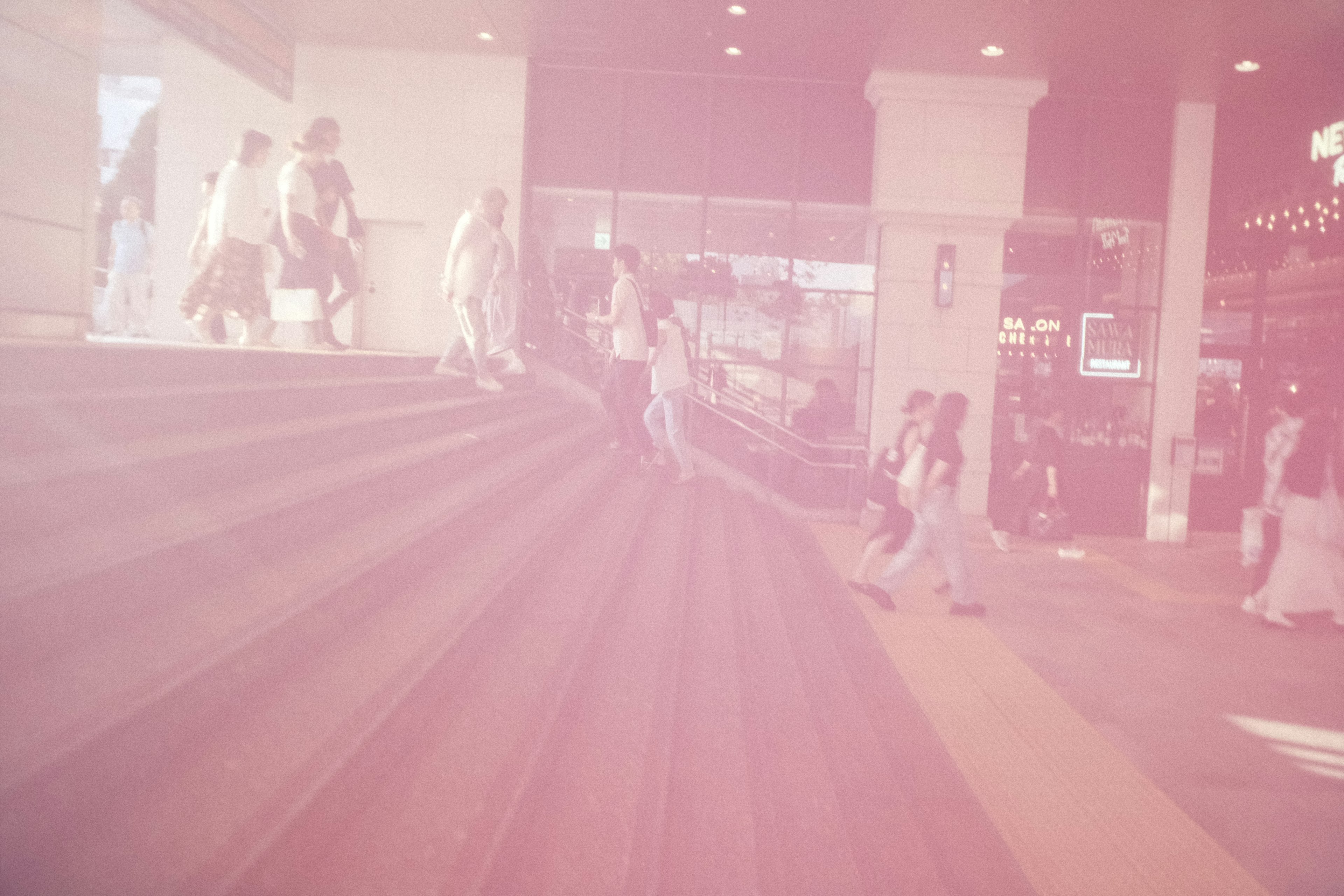 Blurred image of people ascending stairs in a modern interior